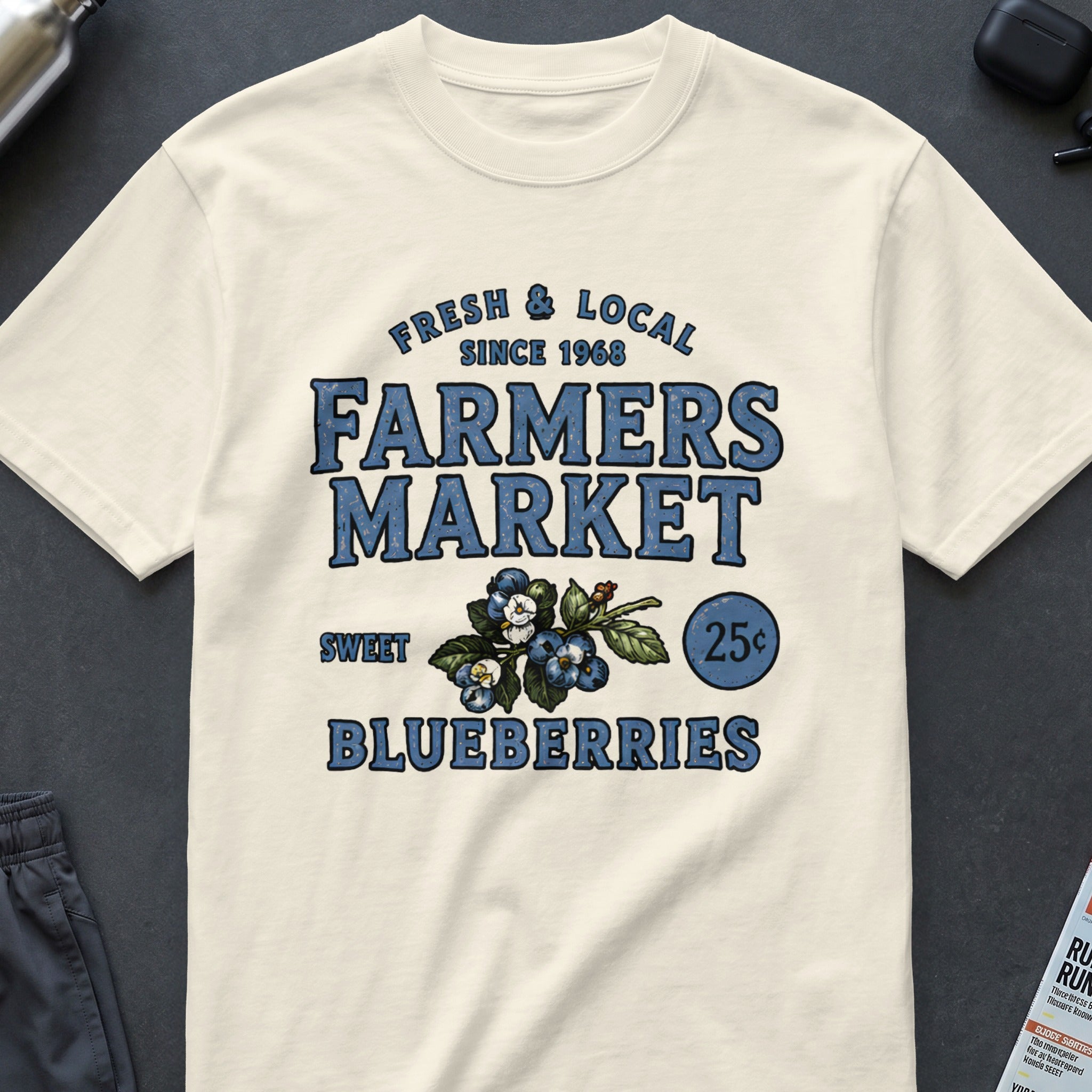 Cream t-shirt with "Farmers Market Sweet Blueberries" text and blueberry graphic.