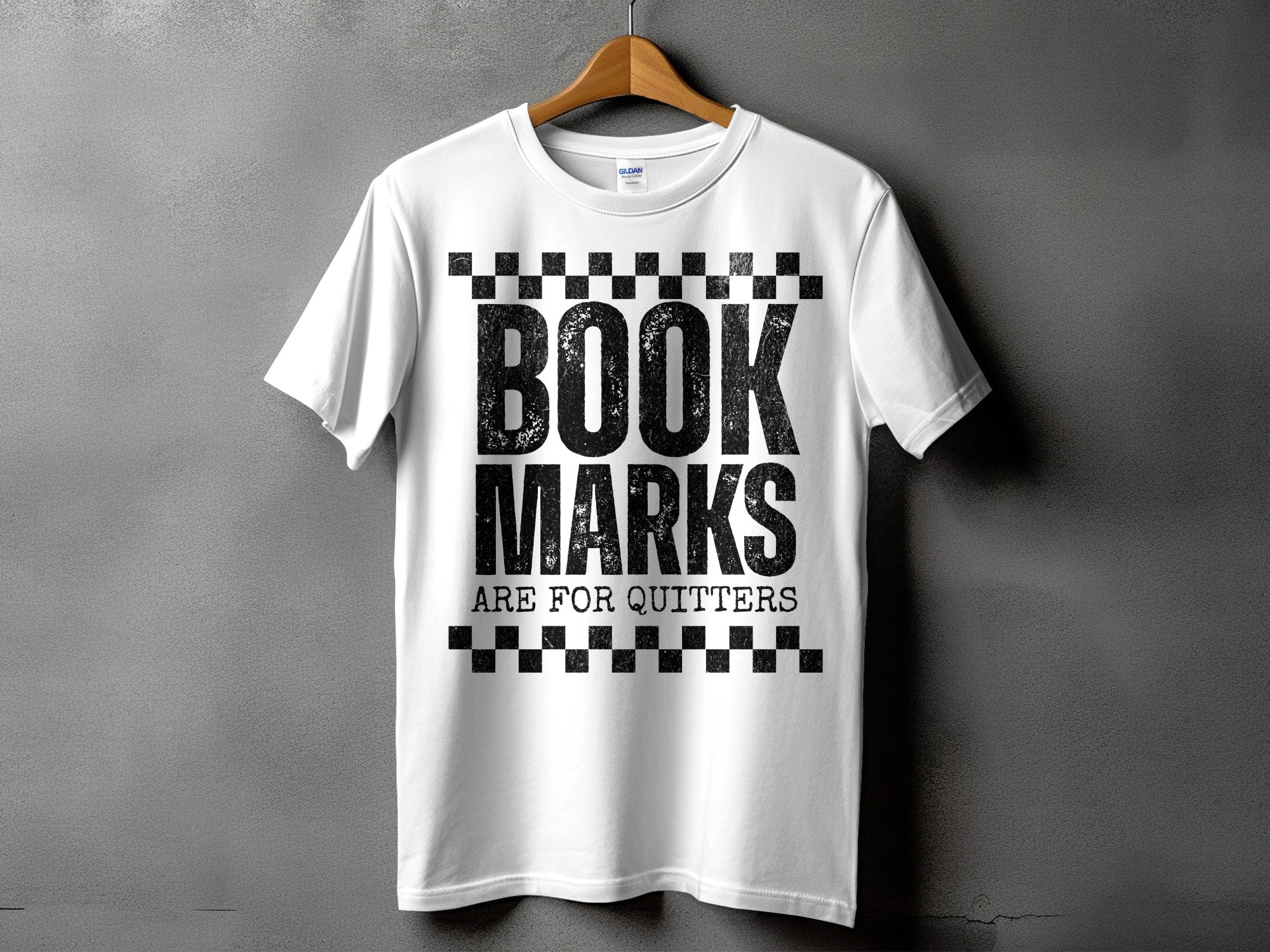 White t-shirt with black text "BOOK MARKS ARE FOR QUITTERS".