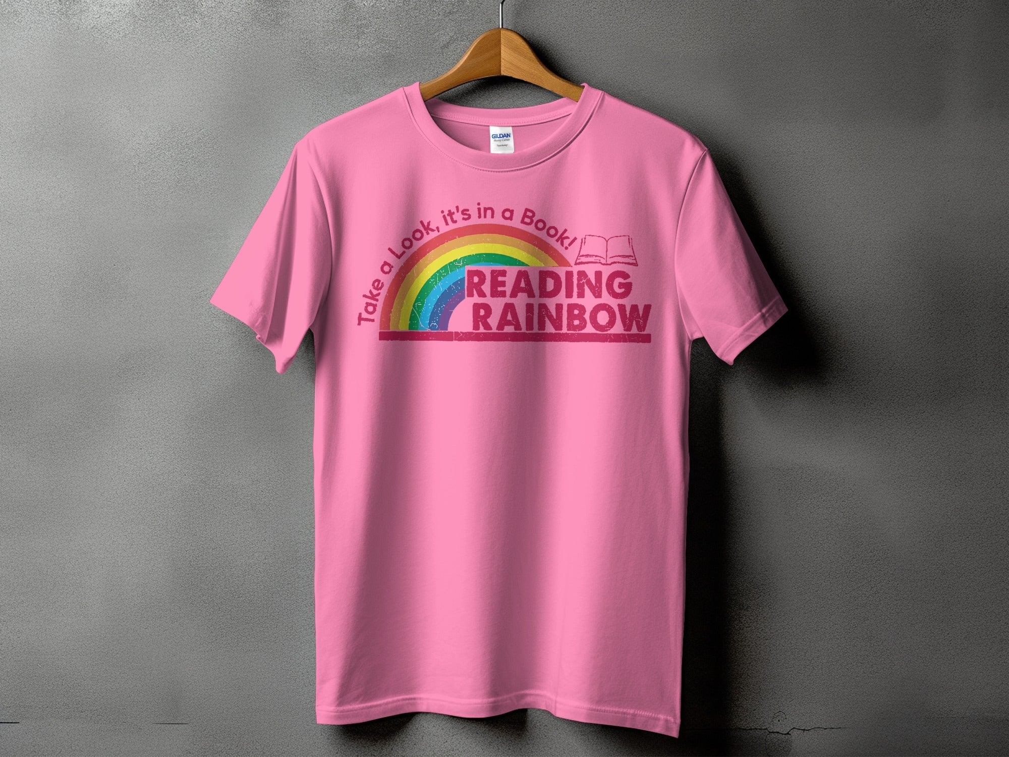 Pink t-shirt with "Reading Rainbow" and a rainbow graphic.