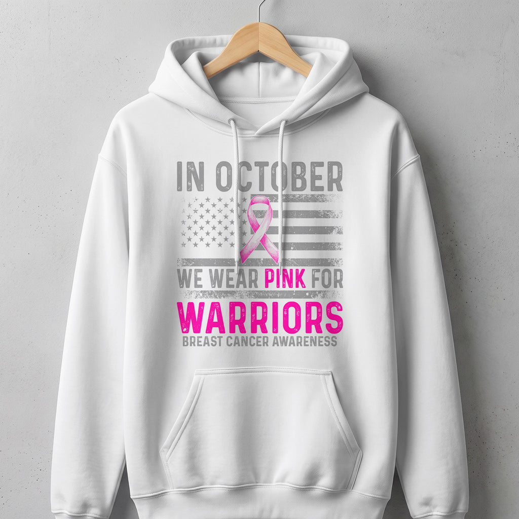 White hoodie with "In October We Wear Pink For Warriors" breast cancer awareness graphic.