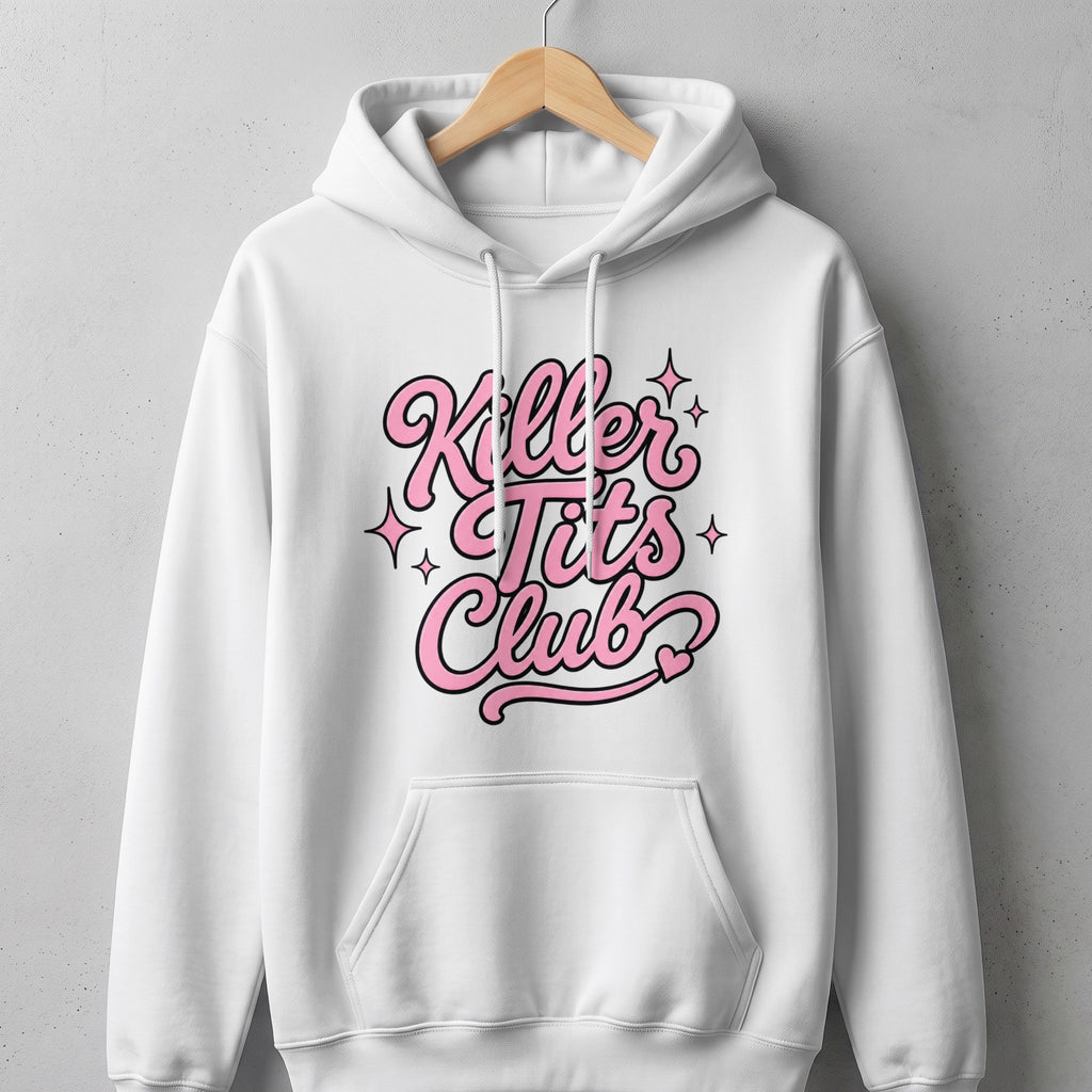 White hoodie with pink text that reads "Killer Tits Club" and sparkle details.