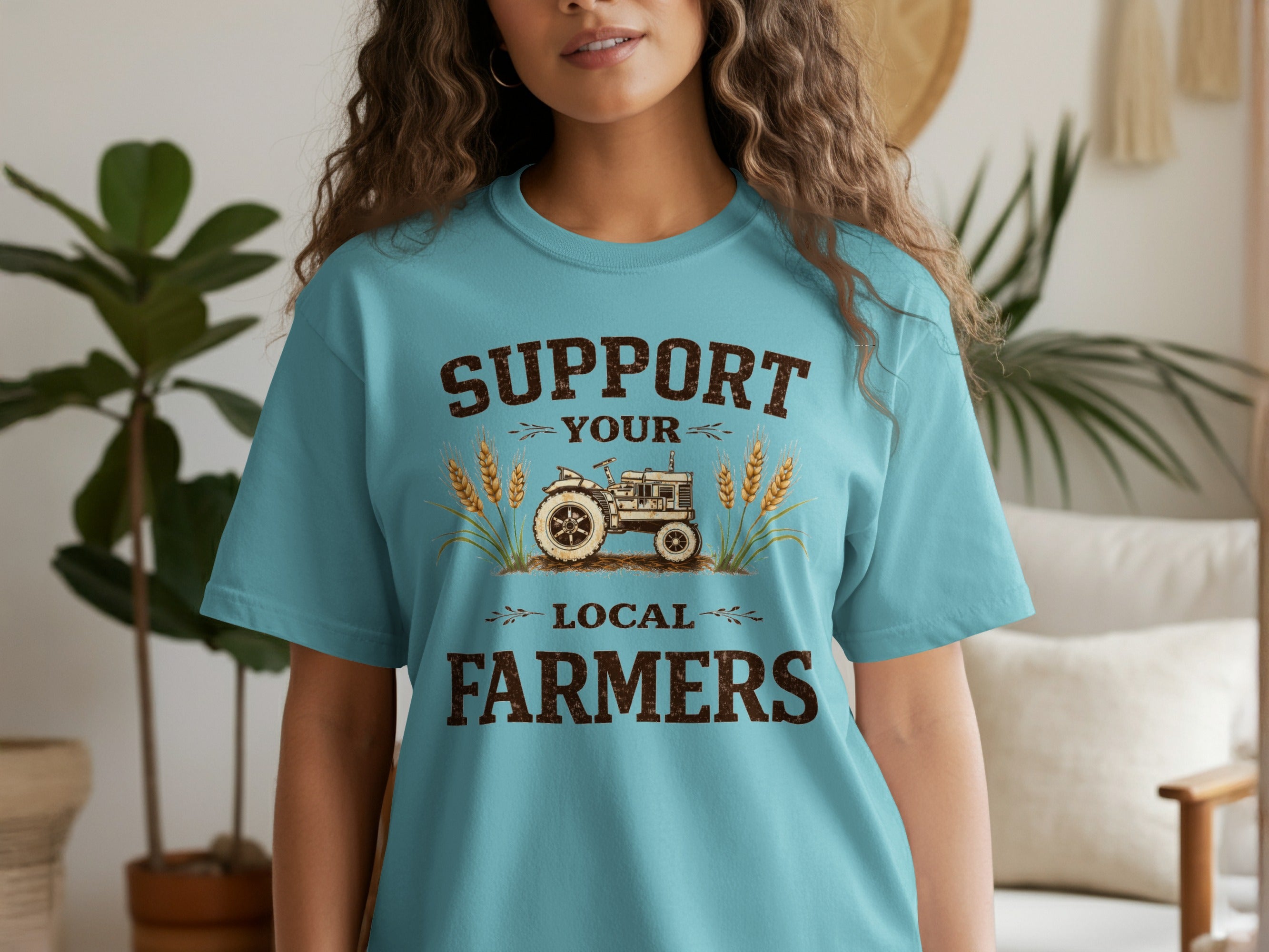 T-shirt with distressed text "Support Your Local Farmers" and a vintage tractor graphic.