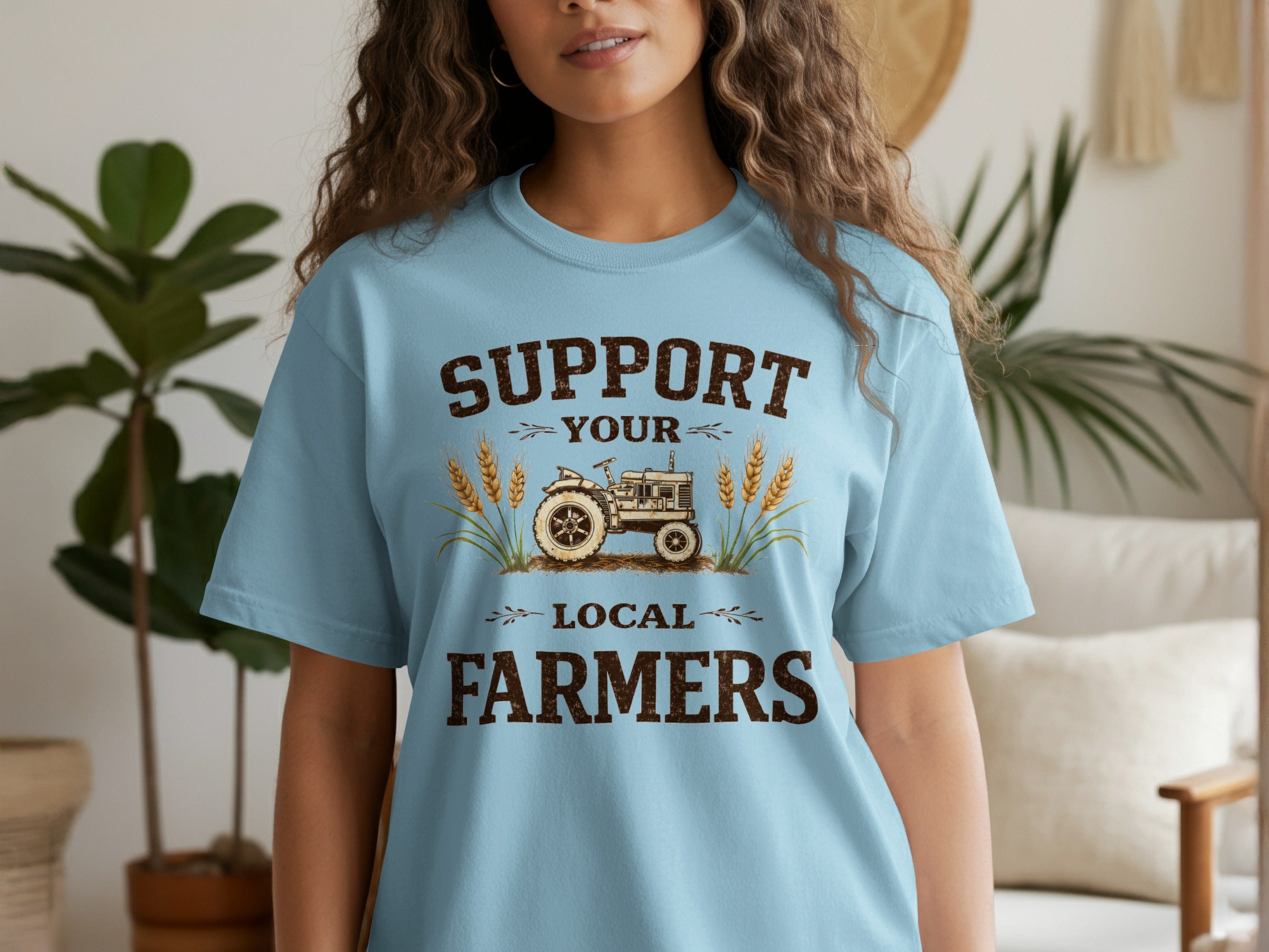 Light blue t-shirt with "Support Your Local Farmers" text and a vintage tractor graphic.