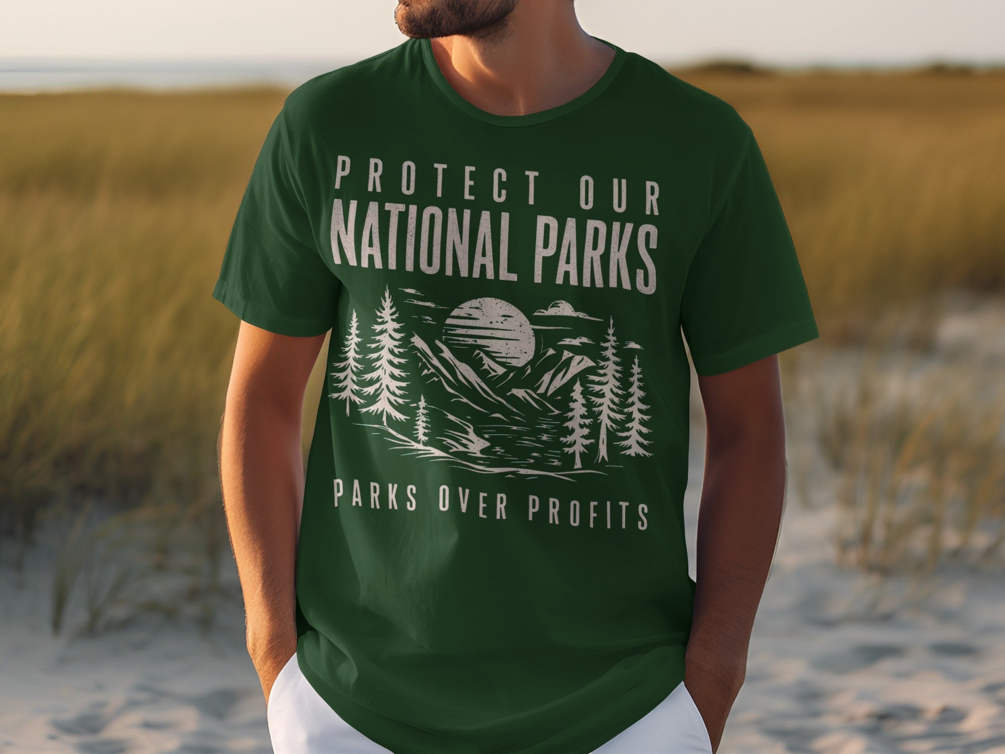 Green t-shirt with "Protect Our National Parks Parks Over Profits" text and mountain scene.
