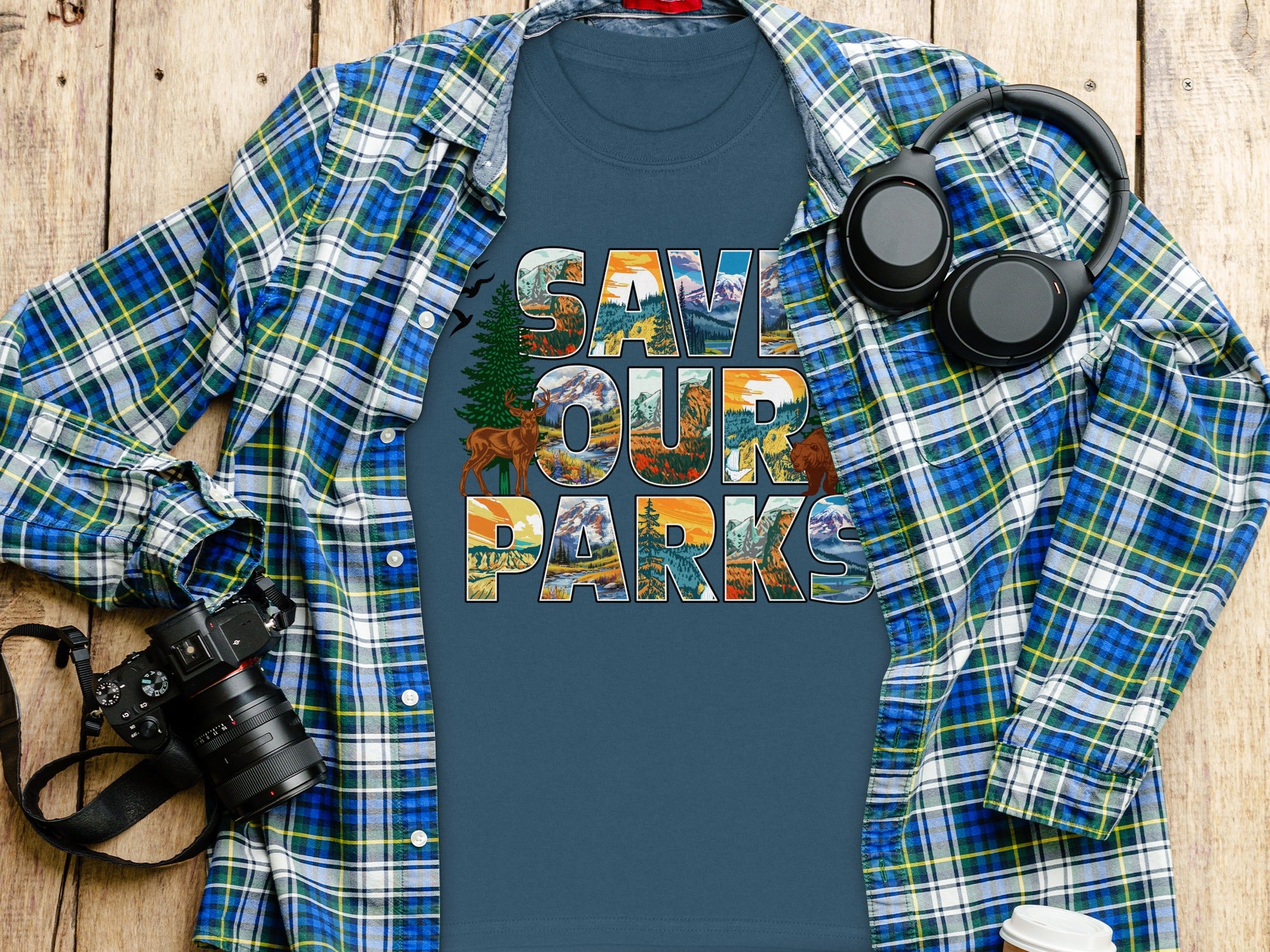 T-shirt with "Save Our Parks" text, featuring wilderness scenes and animals.
