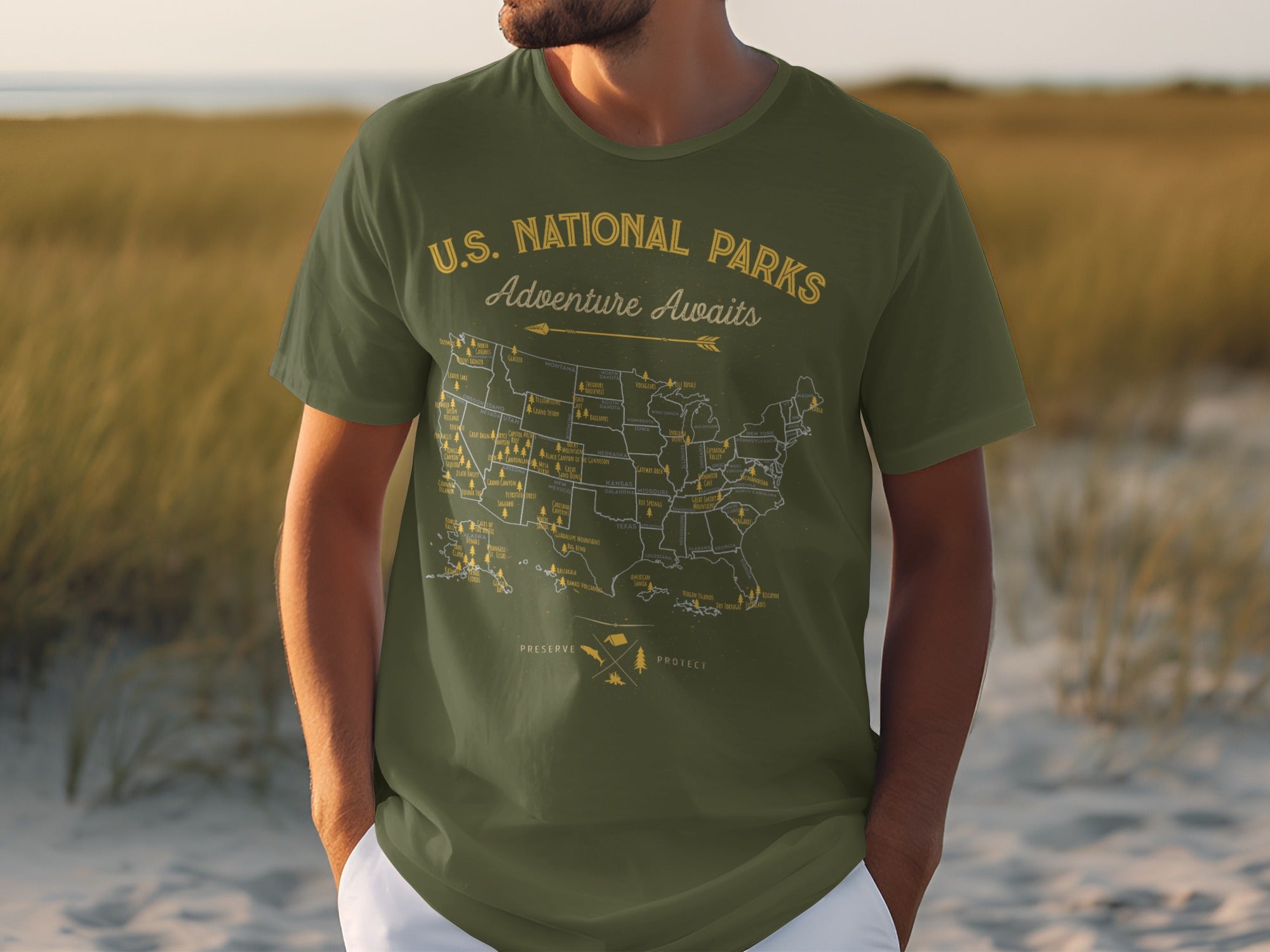 Green t-shirt with U.S. National Parks map and "Adventure Awaits" text.