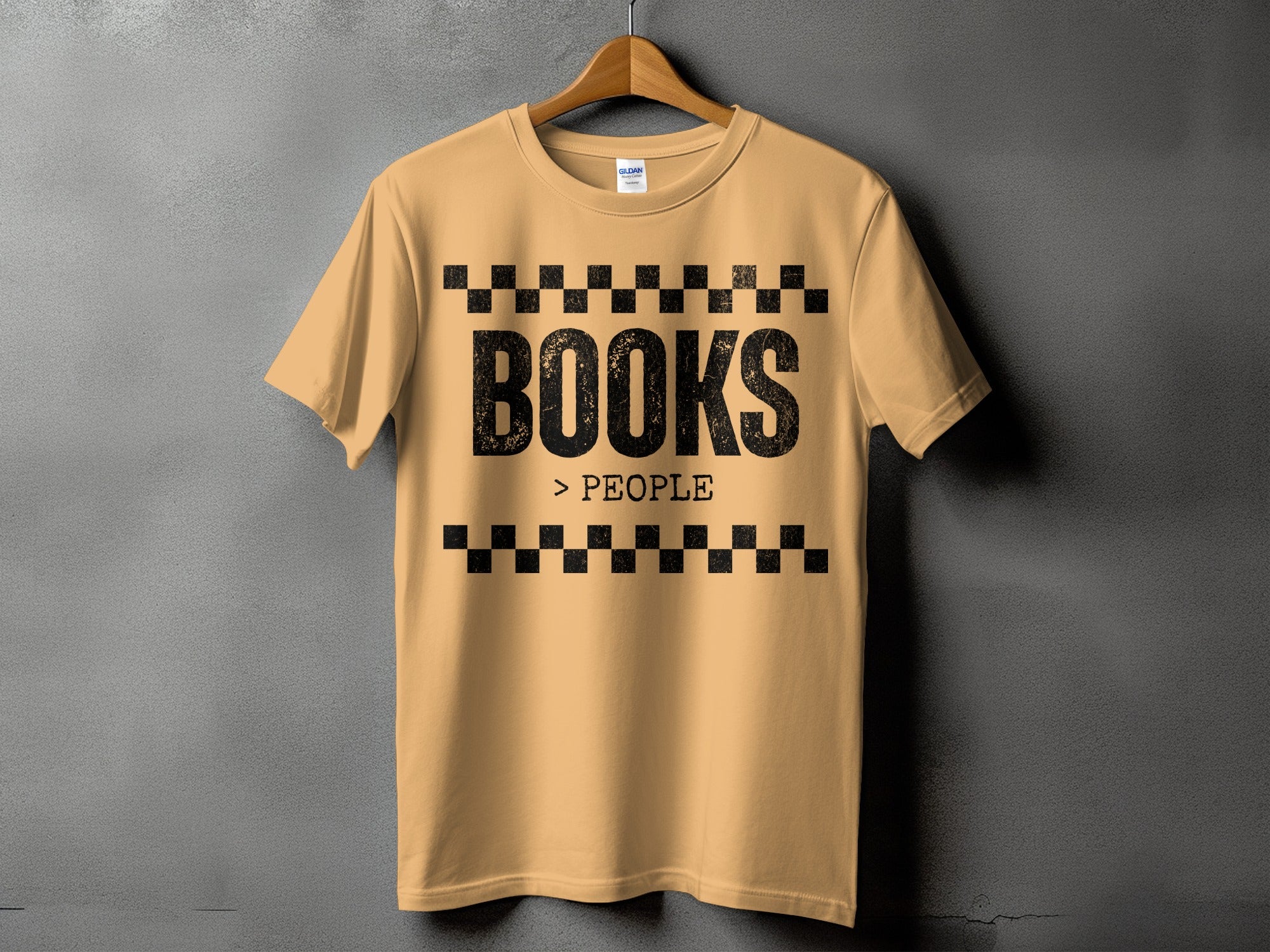 Light brown t-shirt with black lettering reading "BOOKS > PEOPLE".