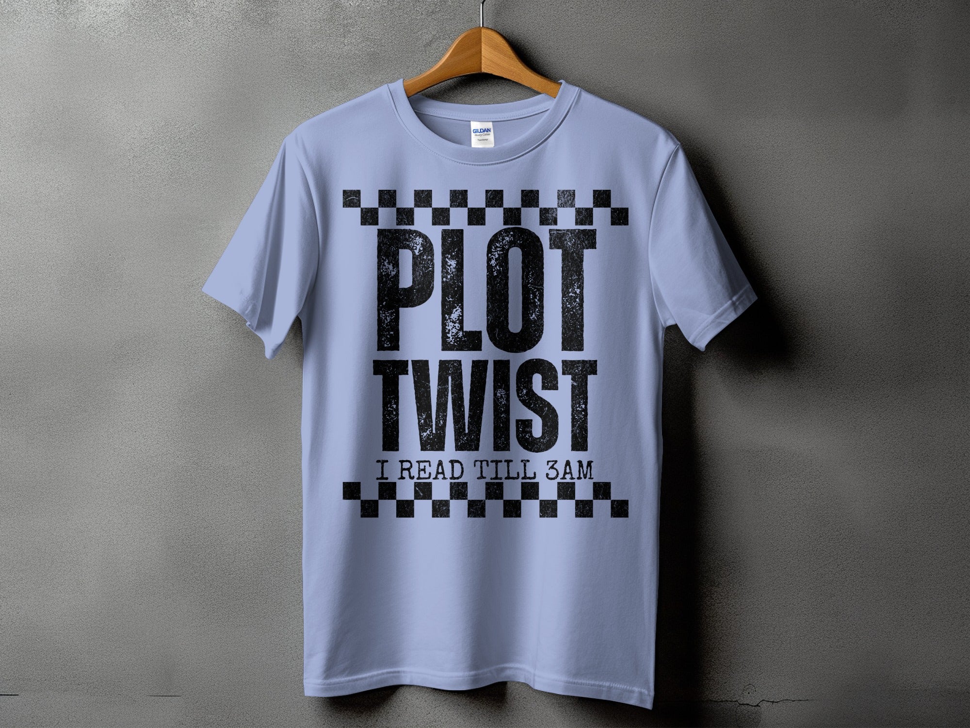 Light blue t-shirt with black text "PLOT TWIST I READ TILL 3AM".