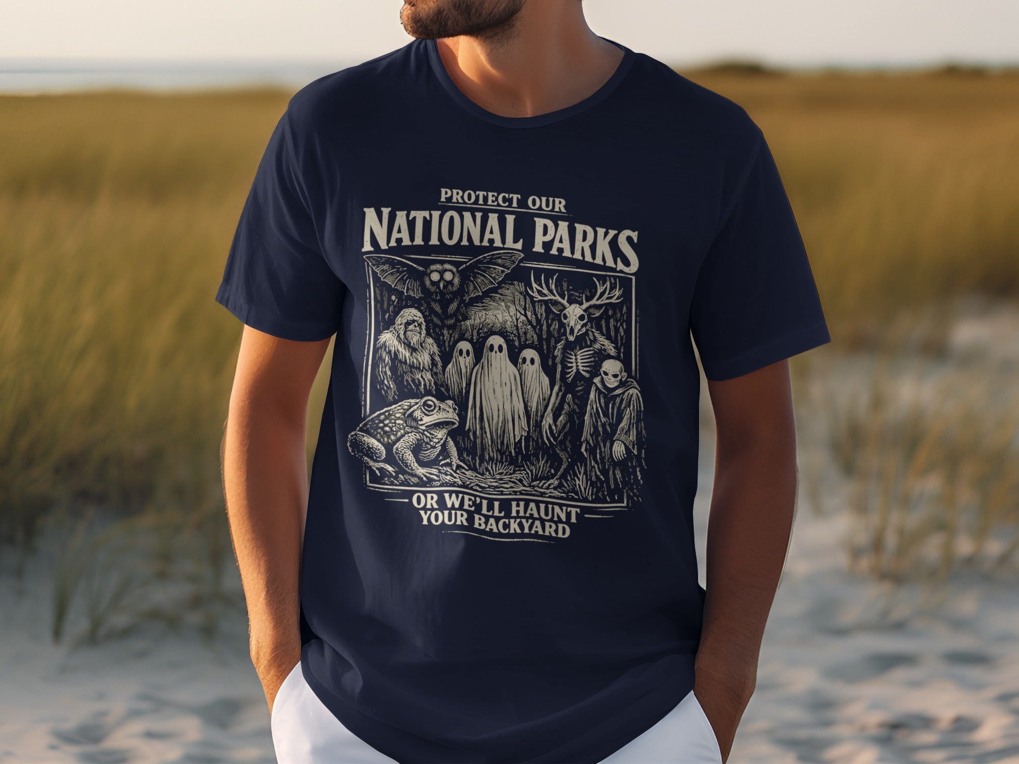Dark blue t-shirt with "Protect Our National Parks Or We'll Haunt Your Backyard" graphic.