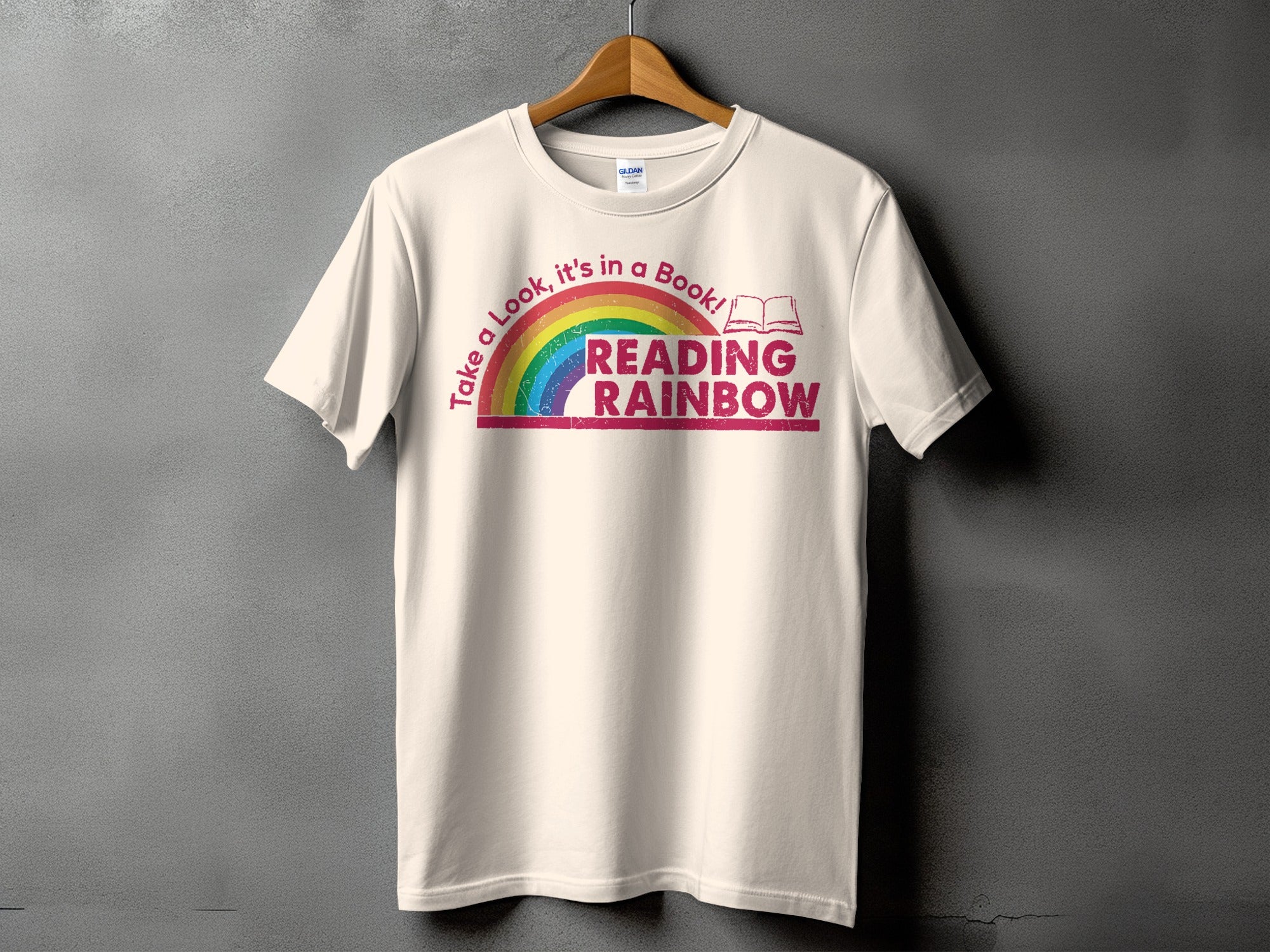 Cream t-shirt with rainbow and "Reading Rainbow" text.