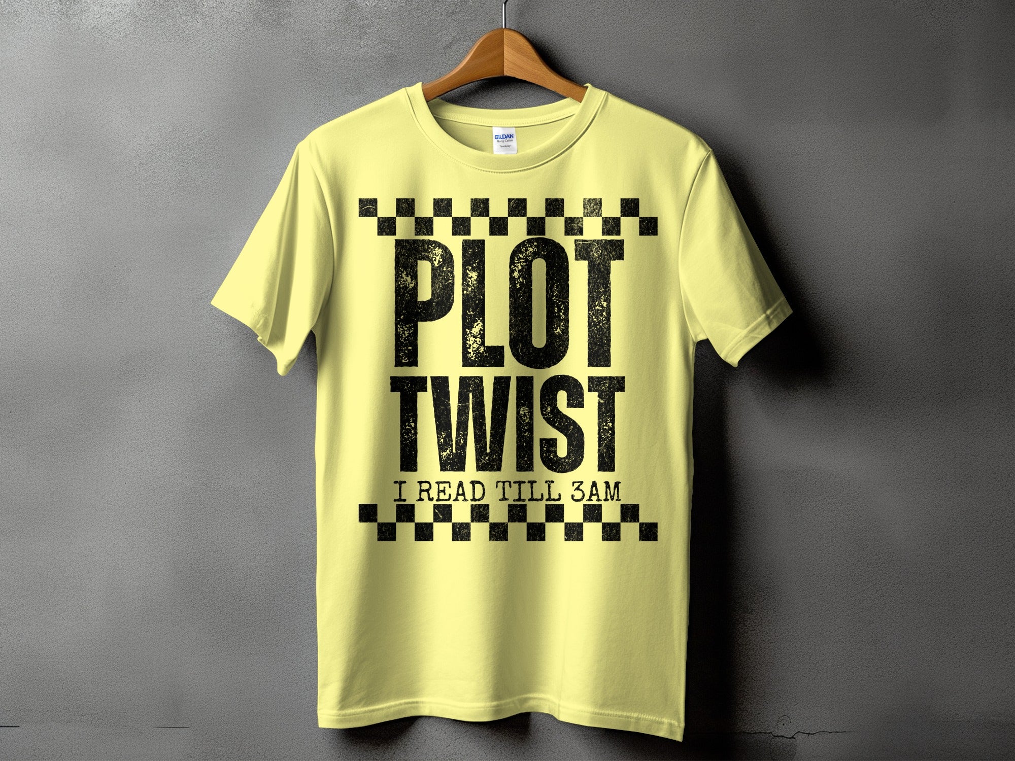 Yellow t-shirt with distressed black text reading "PLOT TWIST I READ TILL 3AM".
