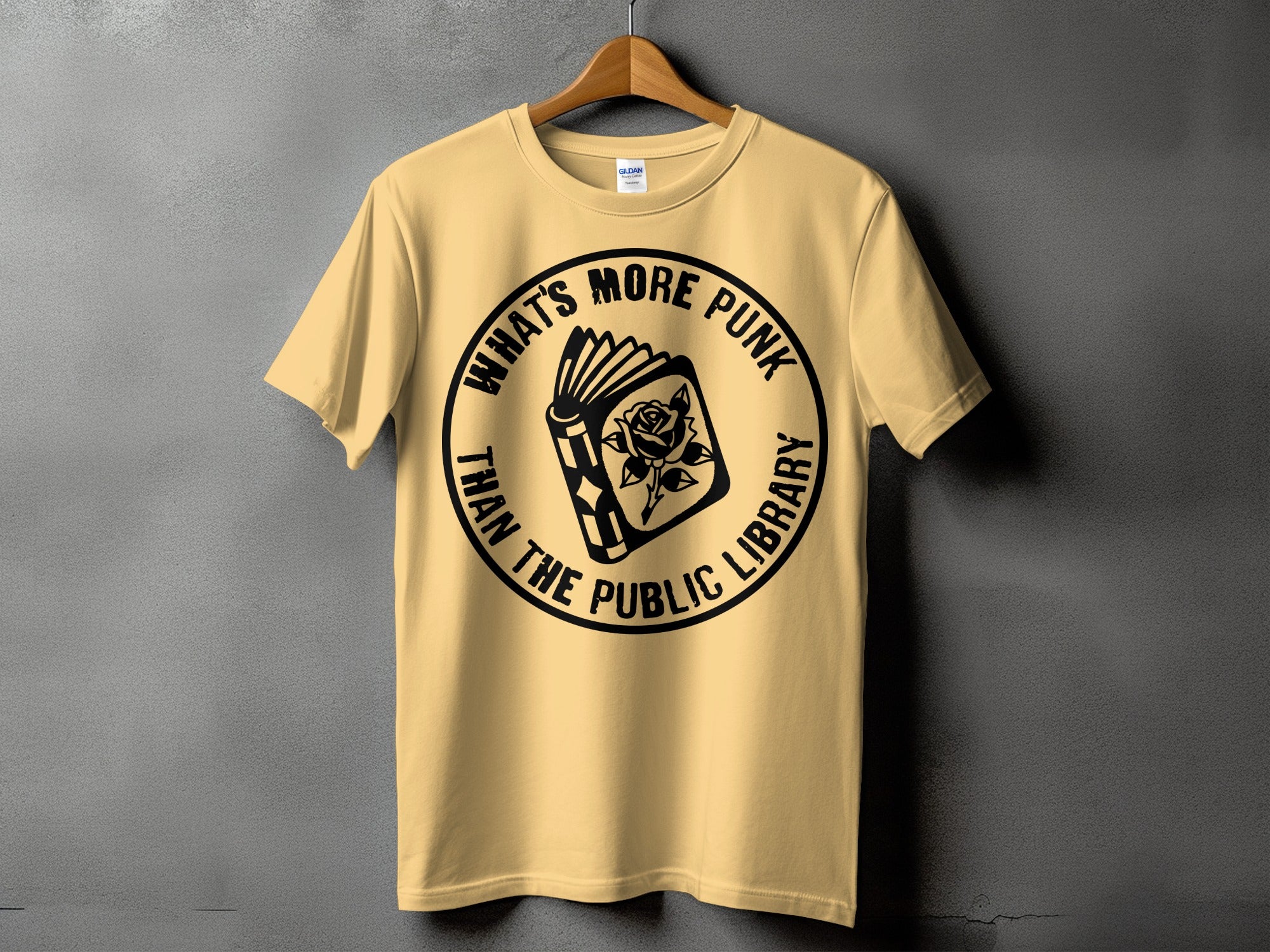 Yellow t-shirt with black graphic text and design of a book with a rose.