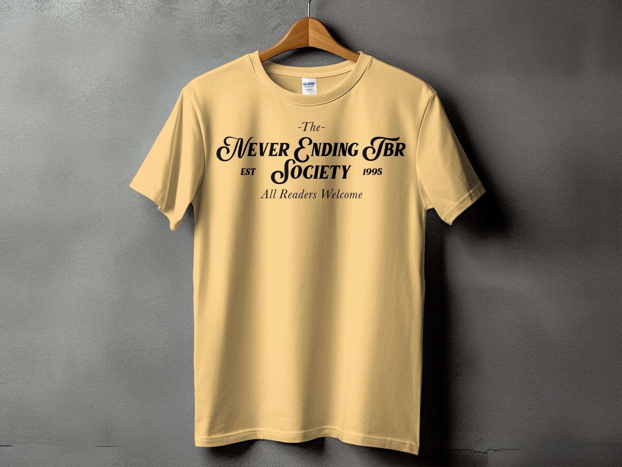 Yellow t-shirt with black text "The Never Ending TBR Society est 1995 All Readers Welcome".