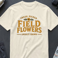 Cream t-shirt with "Fresh Picked Field Flowers" text and floral graphic.