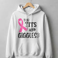 White hoodie with pink ribbon and text "For Tits and Giggles".