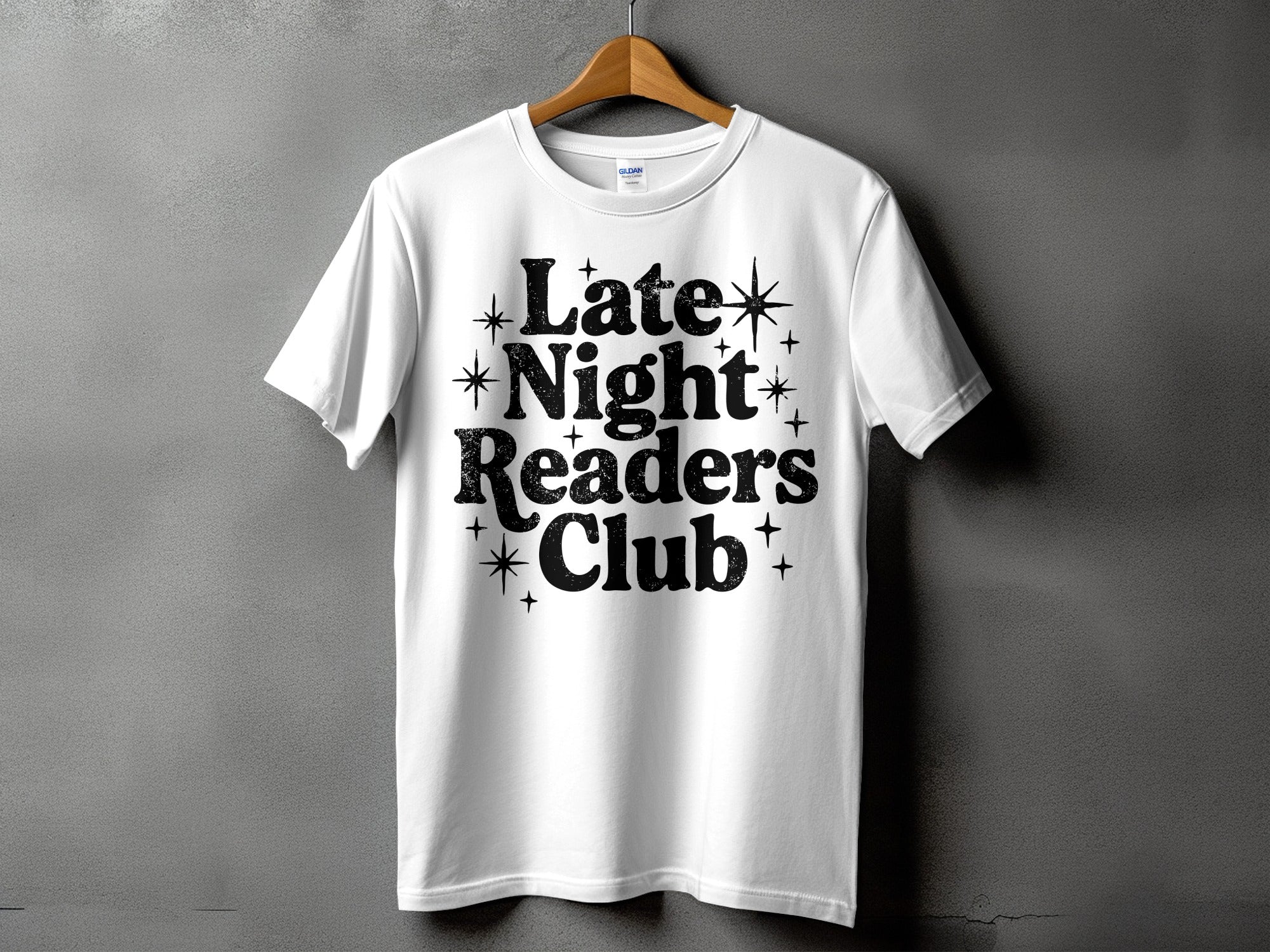 White t-shirt with "Late Night Readers Club" in distressed black lettering.