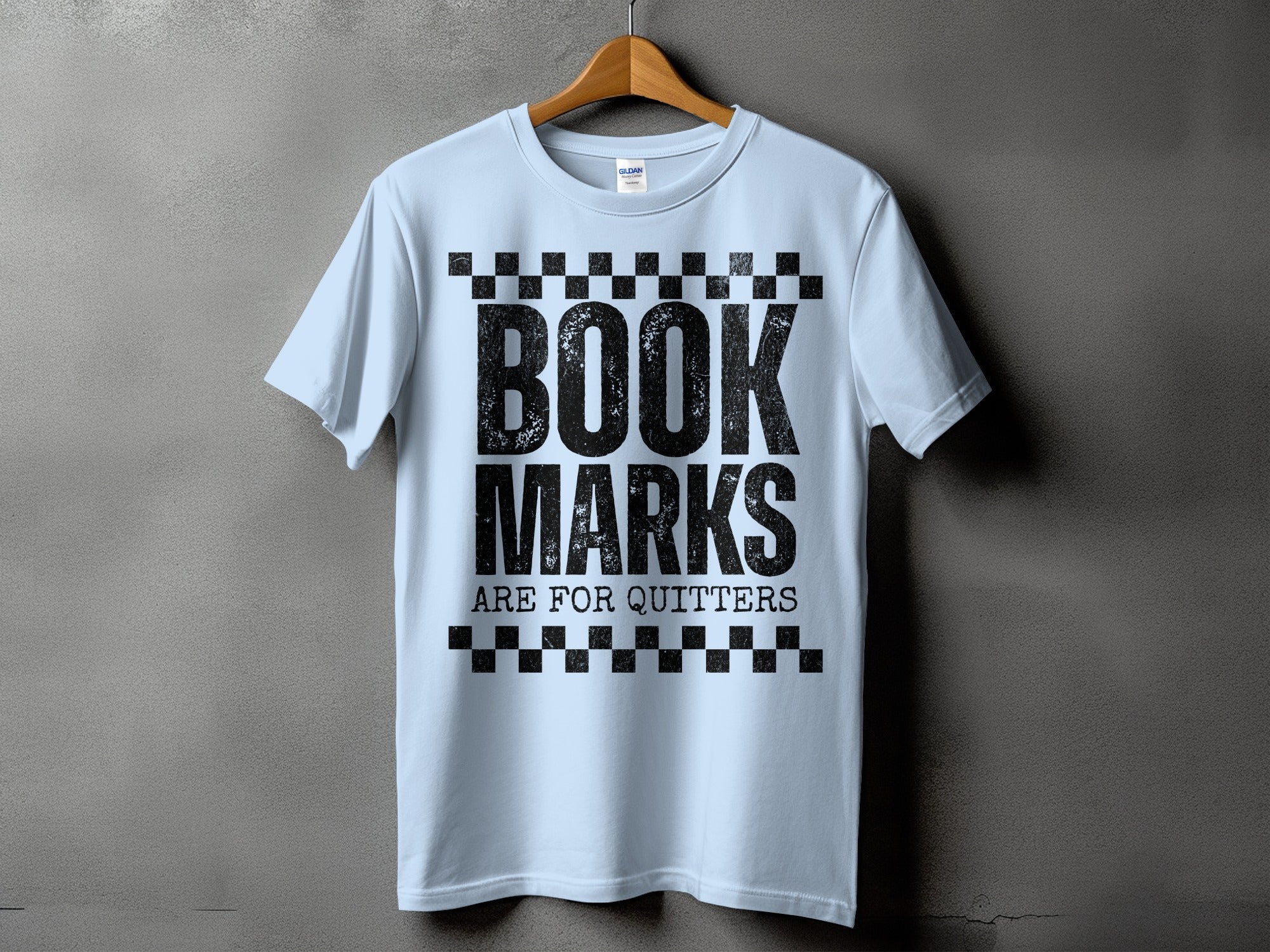 Light blue t-shirt with black text "BOOK MARKS ARE FOR QUITTERS"
