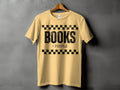 Yellow t-shirt with black text "BOOKS > PEOPLE" and checkered design.