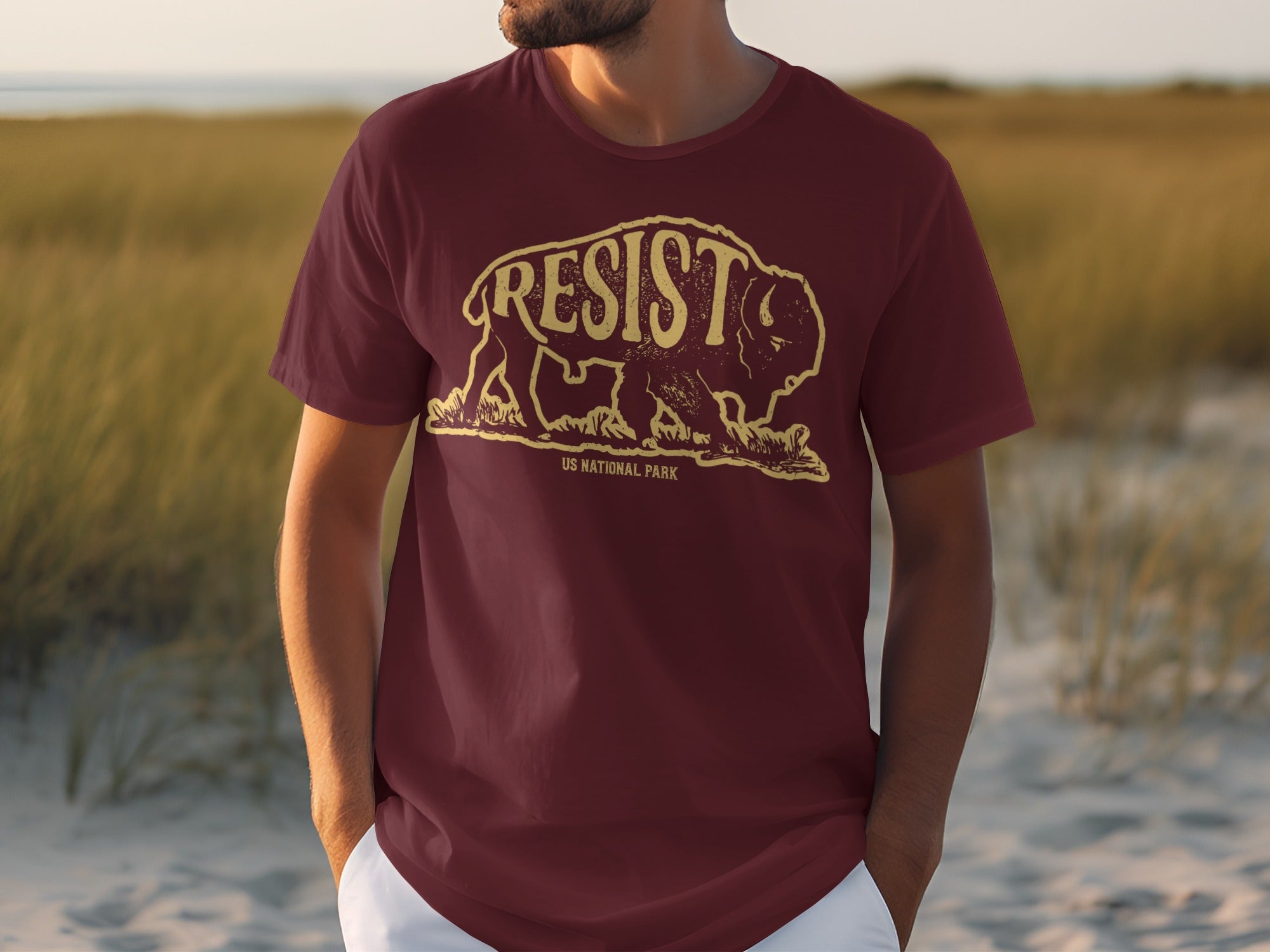 Maroon t-shirt with distressed graphic of a bison and "RESIST US NATIONAL PARK" text.