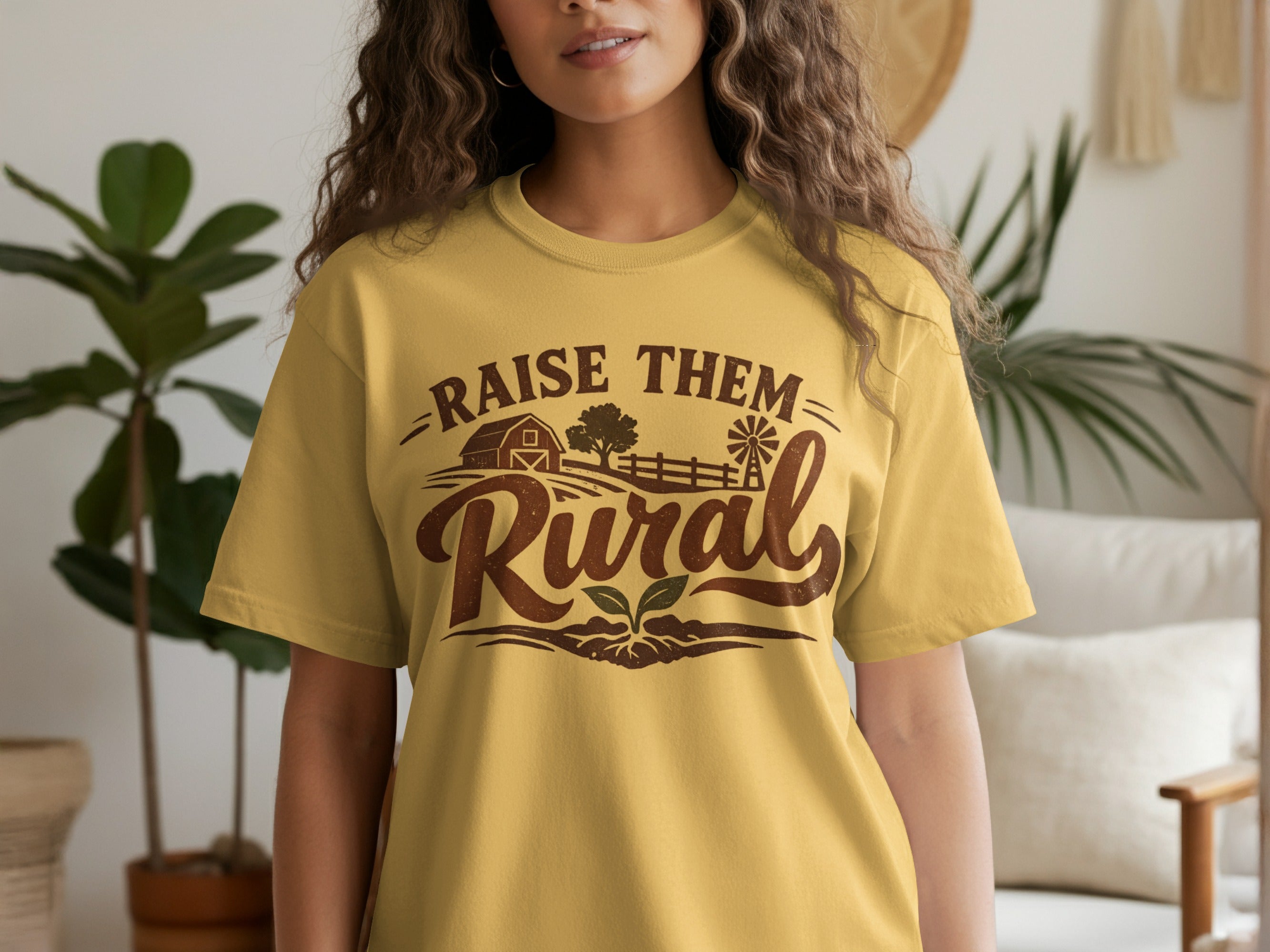 Yellow t-shirt with rustic farm graphic and text "RAISE THEM Rural".