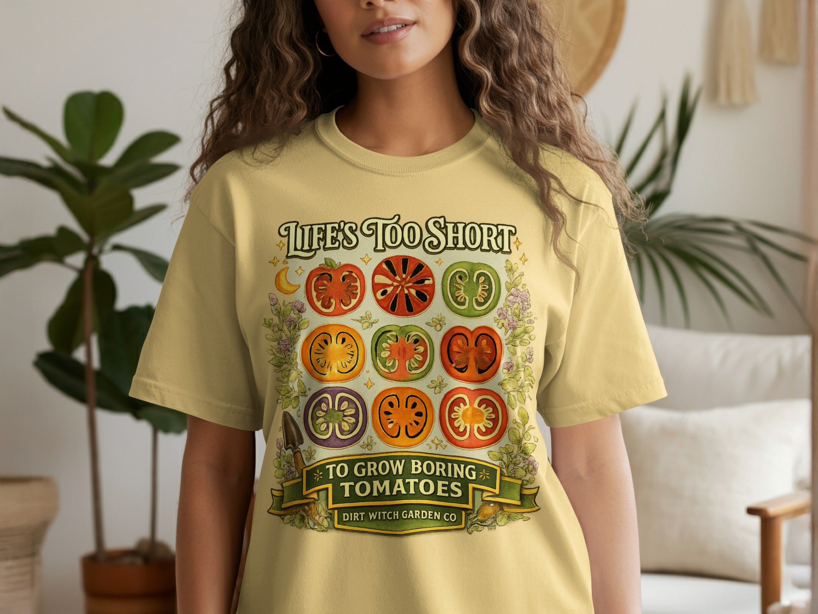 Yellow t-shirt with graphic of nine tomato slices, saying "Life's too short to grow boring tomatoes".