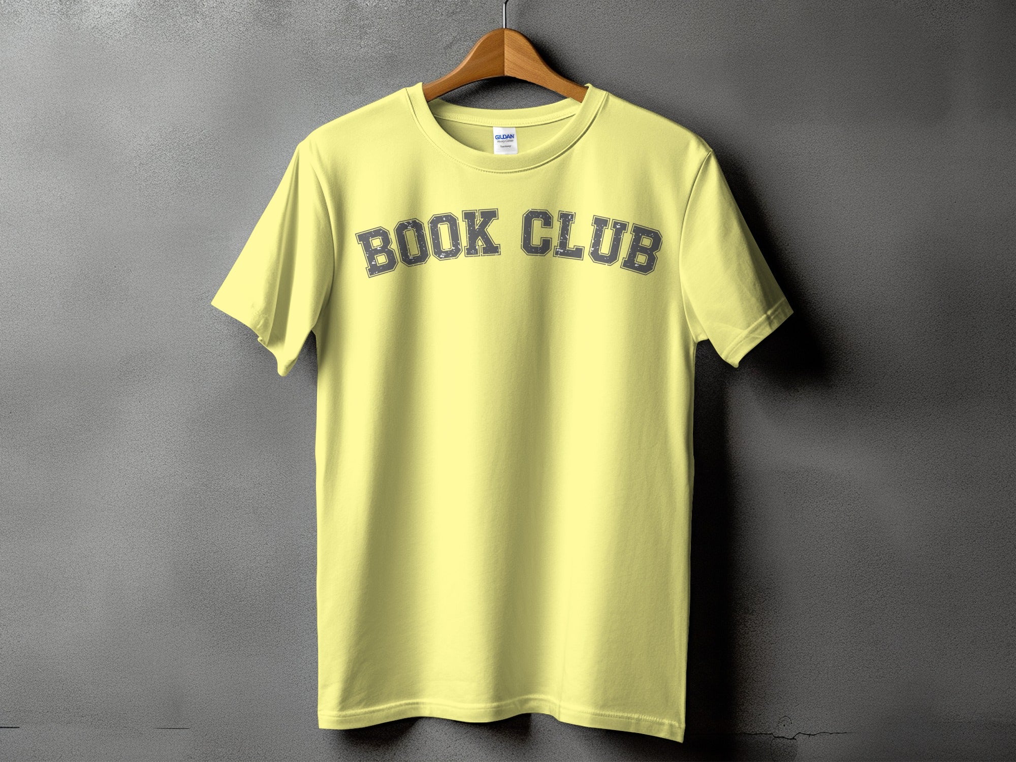 Yellow t-shirt with "BOOK CLUB" text in distressed gray lettering.