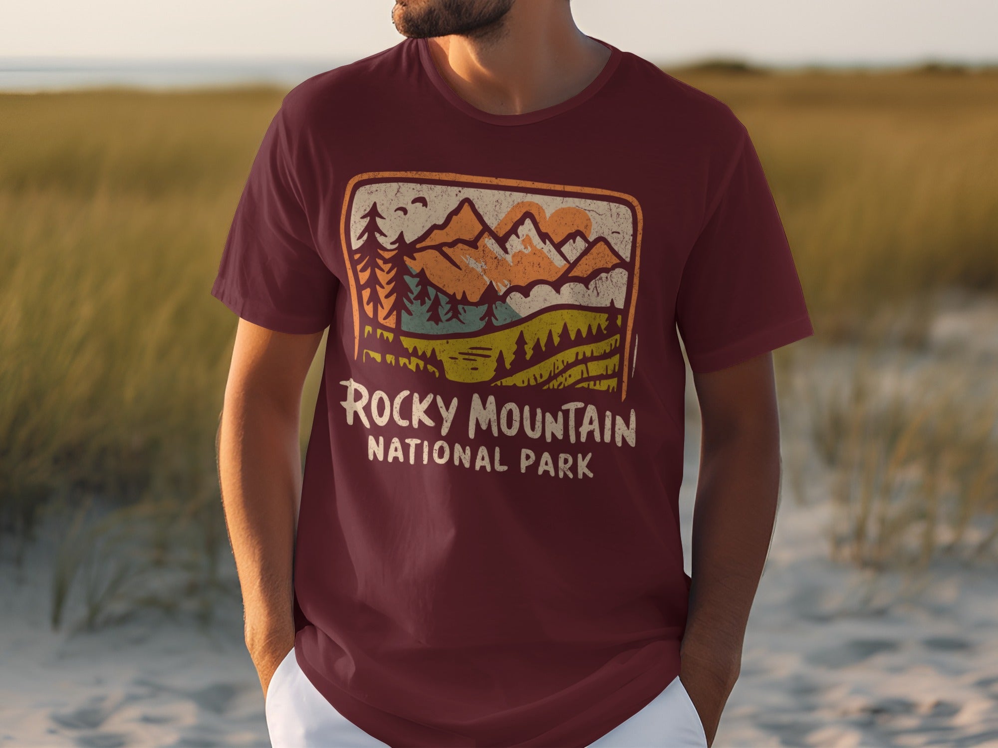 Maroon t-shirt with vintage Rocky Mountain National Park mountain landscape graphic.