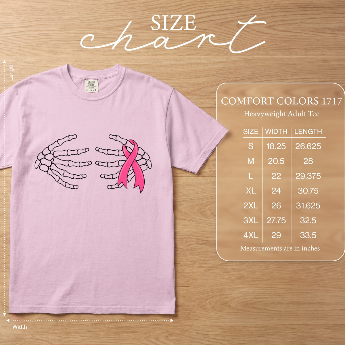 Pink t-shirt with skeleton hands holding a pink ribbon, with size chart.