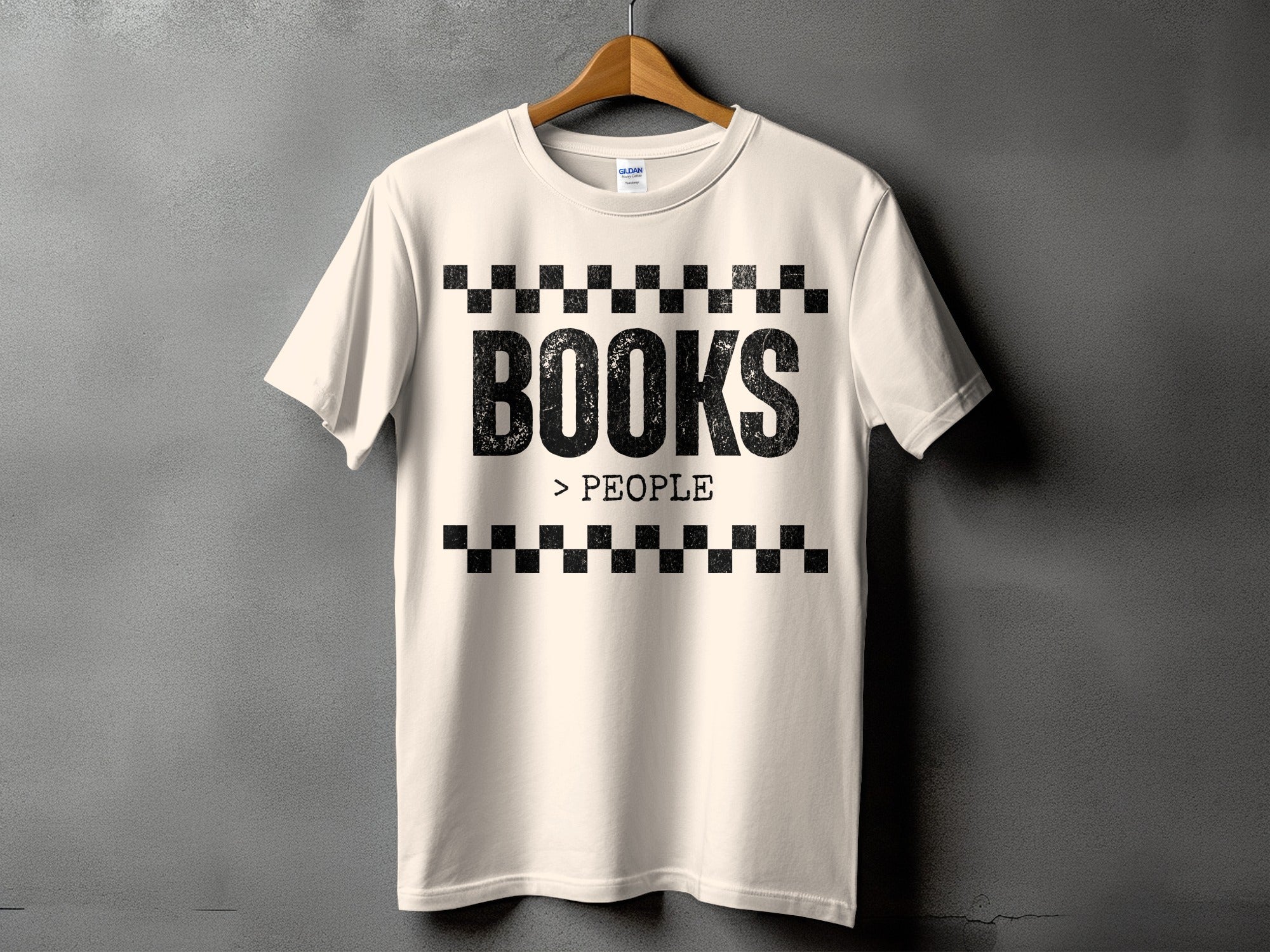 Cream t-shirt with distressed black text "BOOKS > PEOPLE" between checkerboard patterns.
