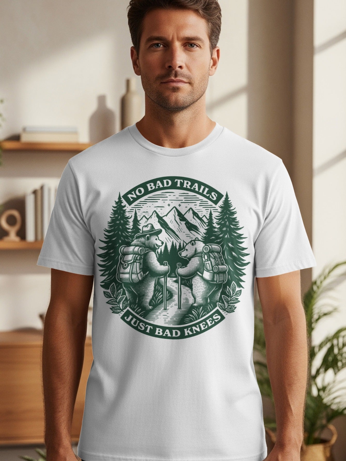 White t-shirt graphic with bears hiking, mountains, trees, and text.