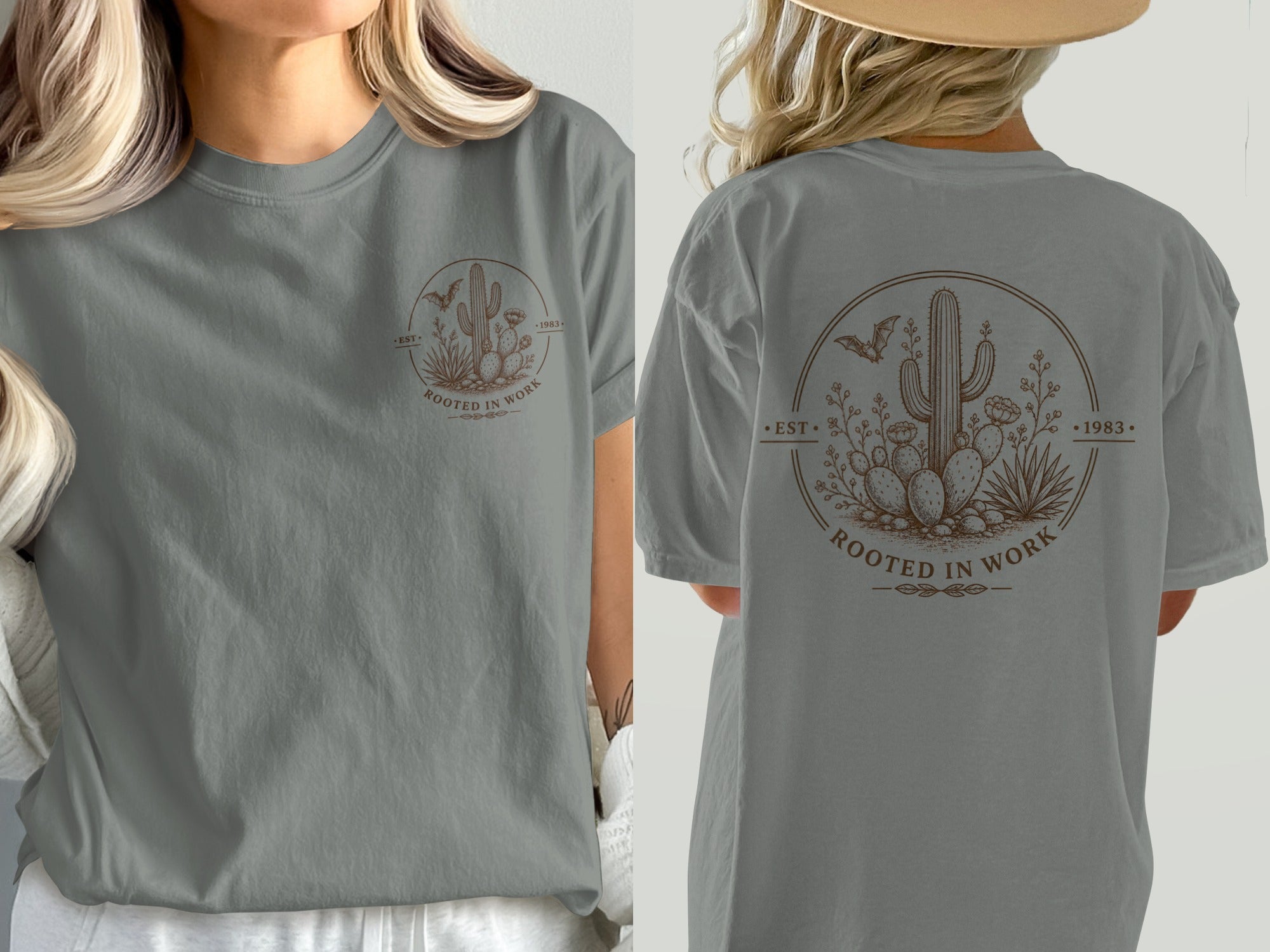 T-shirt with desert-themed circle graphic featuring cacti, bat, and text "ROOTED IN WORK".