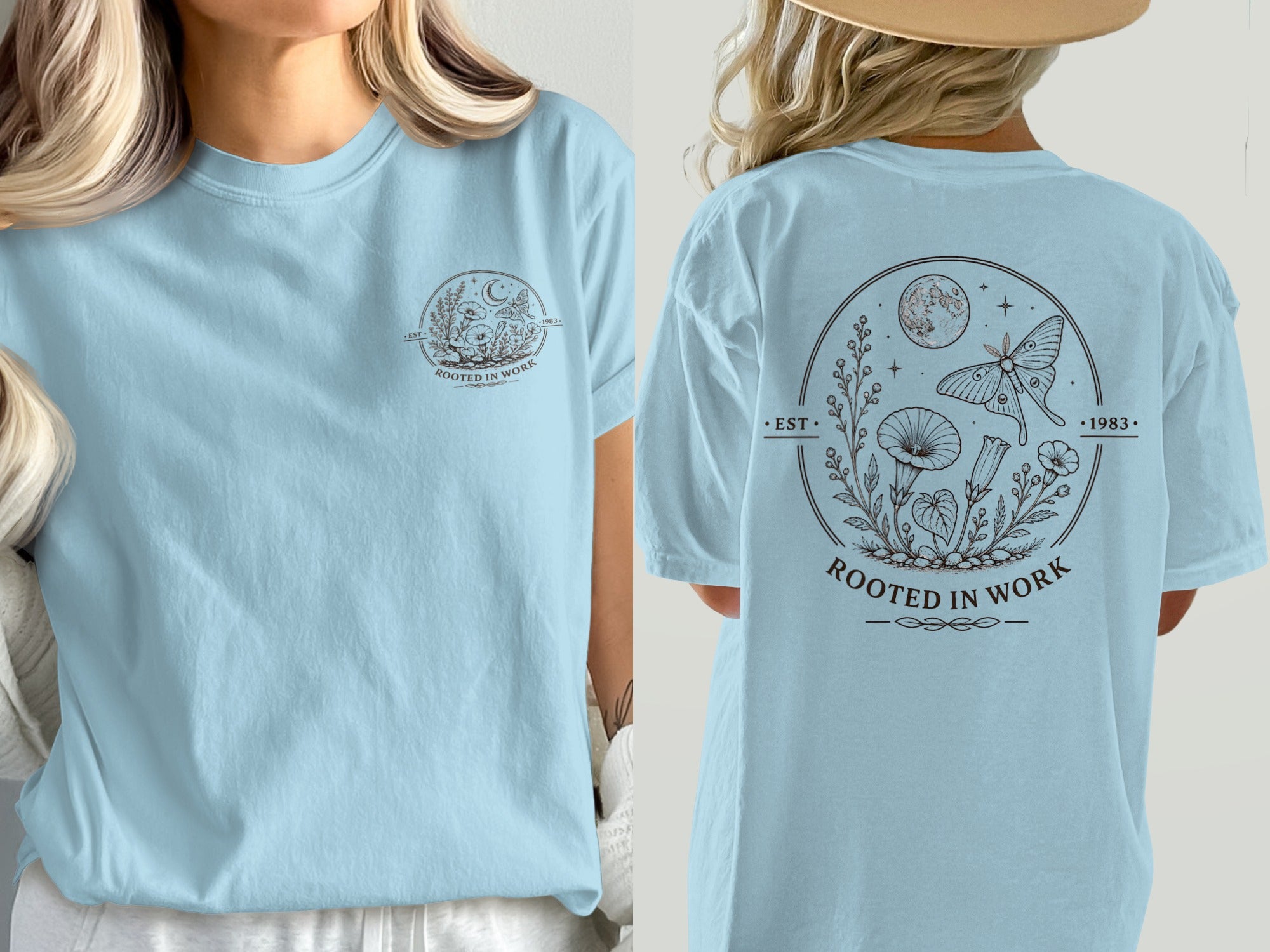 Light blue t-shirt with circular design of moth, moon, and plants, text "Rooted in Work".