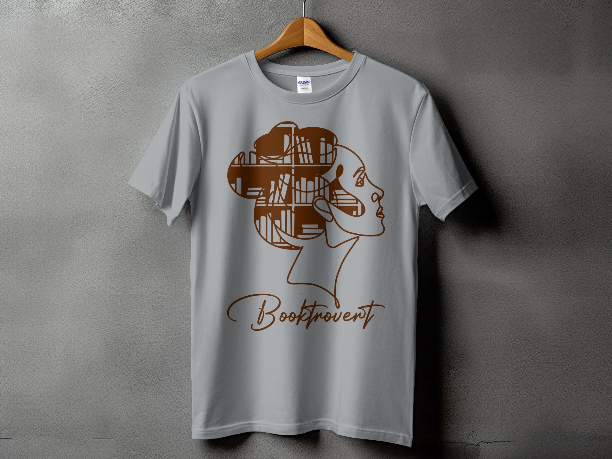Gray t-shirt with a brown outline of a woman's profile and the text "Booktrovert".
