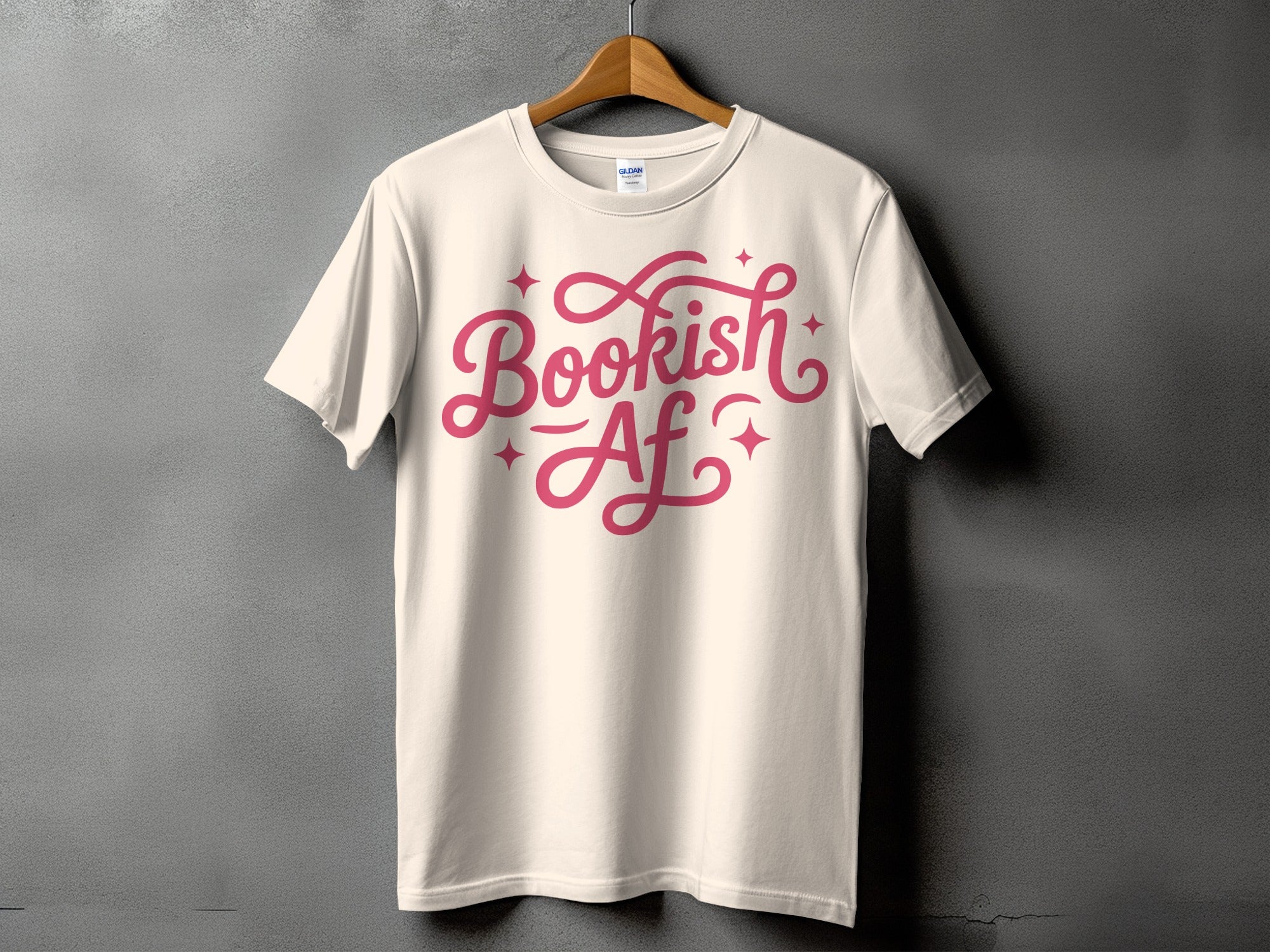 Cream t-shirt with pink text reading "Bookish Af" and small star accents.