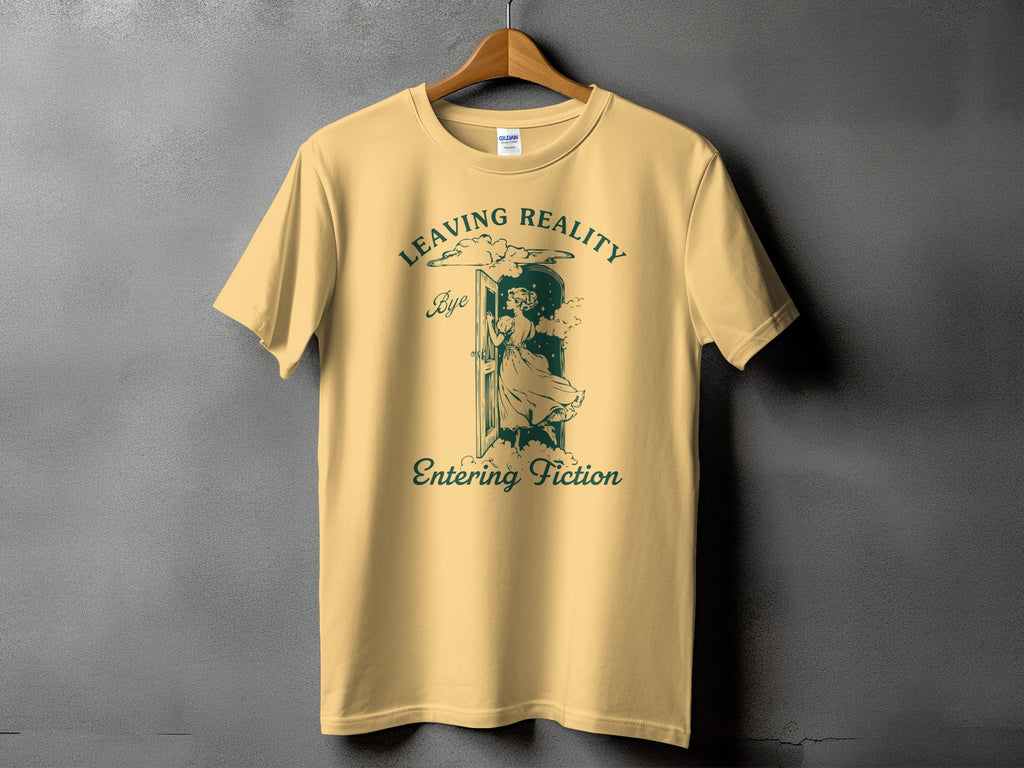 Yellow t-shirt with "Leaving Reality" and "Entering Fiction" text and graphic.