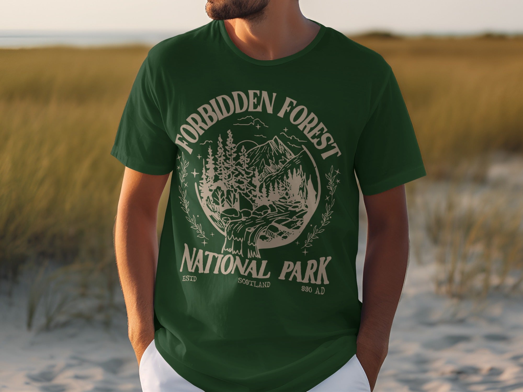 Green t-shirt with vintage Forbidden Forest National Park graphic and text.