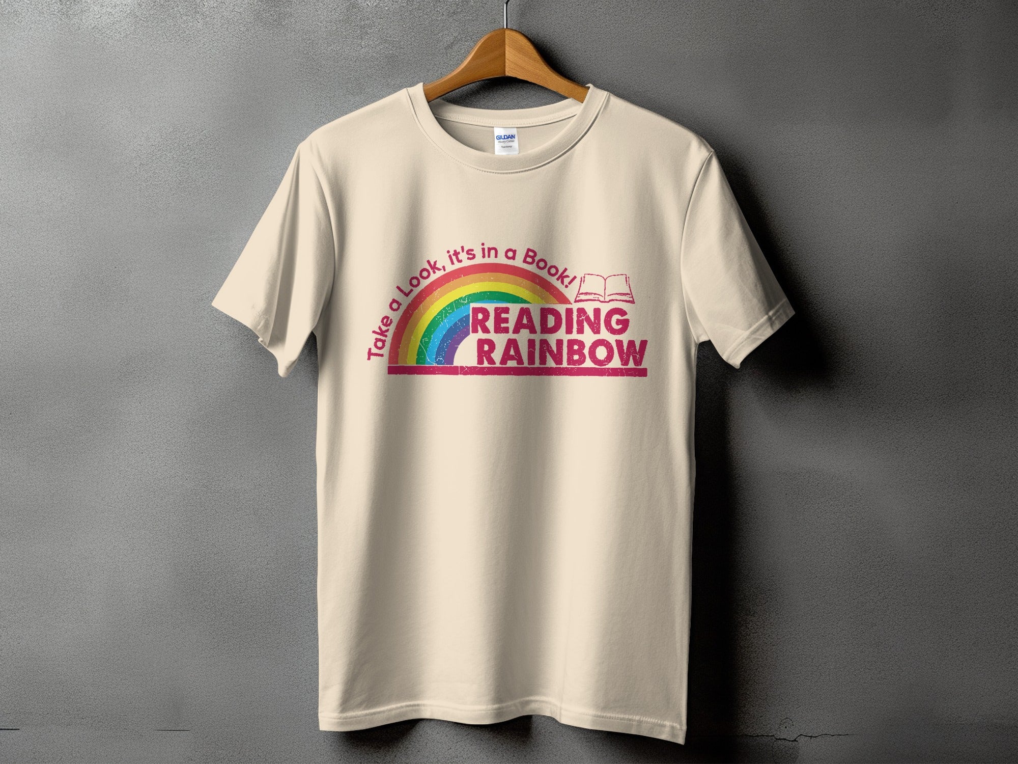 Cream t-shirt with distressed rainbow and "Reading Rainbow" text.