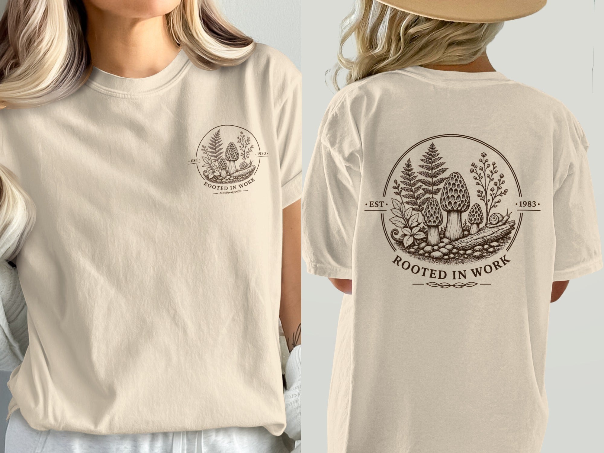 Cream t-shirt with a circular brown graphic of mushrooms, ferns, and a snail, text reads "ROOTED IN WORK EST. 1983".