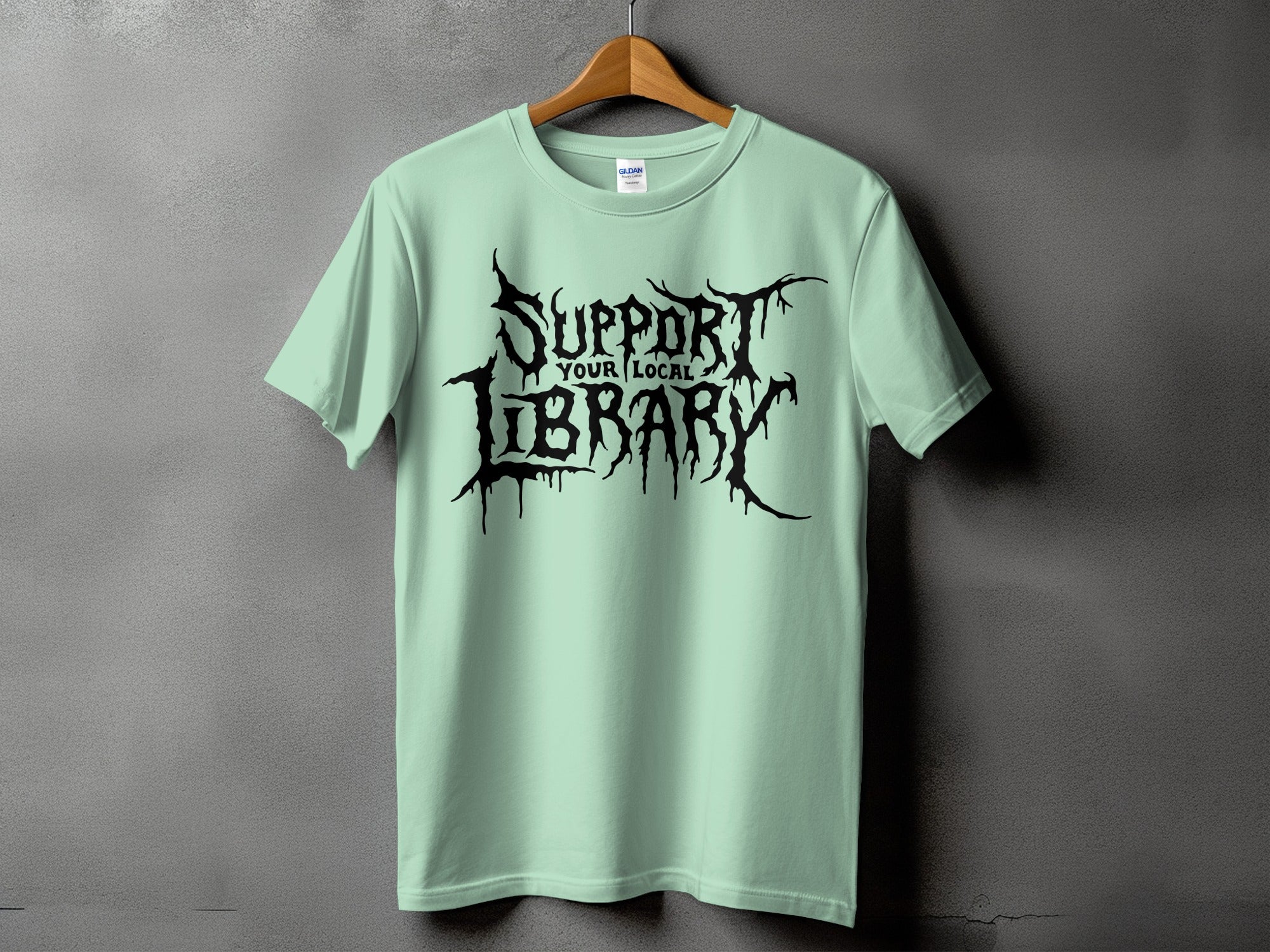 T-shirt with black gothic text "Support Your Local Library."