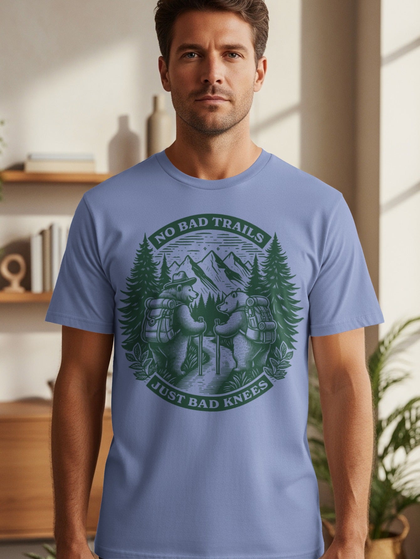 T-shirt featuring bears hiking with text "NO BAD TRAILS JUST BAD KNEES".