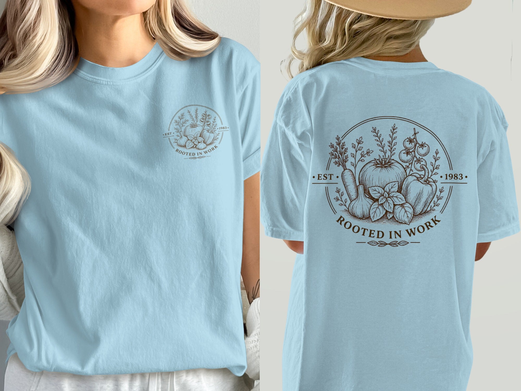 Light blue t-shirt with "Rooted in Work" and vegetable graphic, EST 1983.