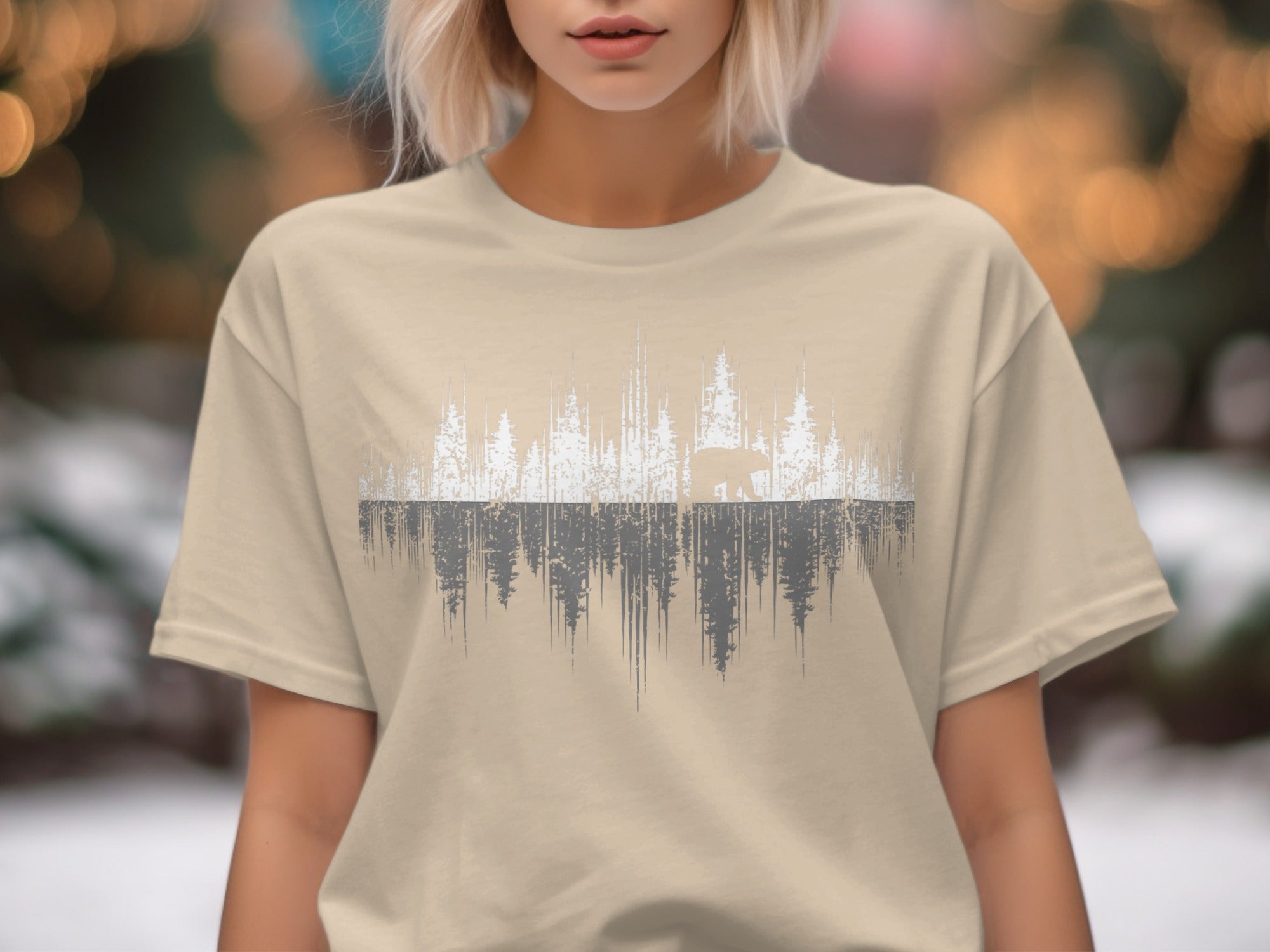 Tan t-shirt with a graphic of a bear and trees in a distressed style.