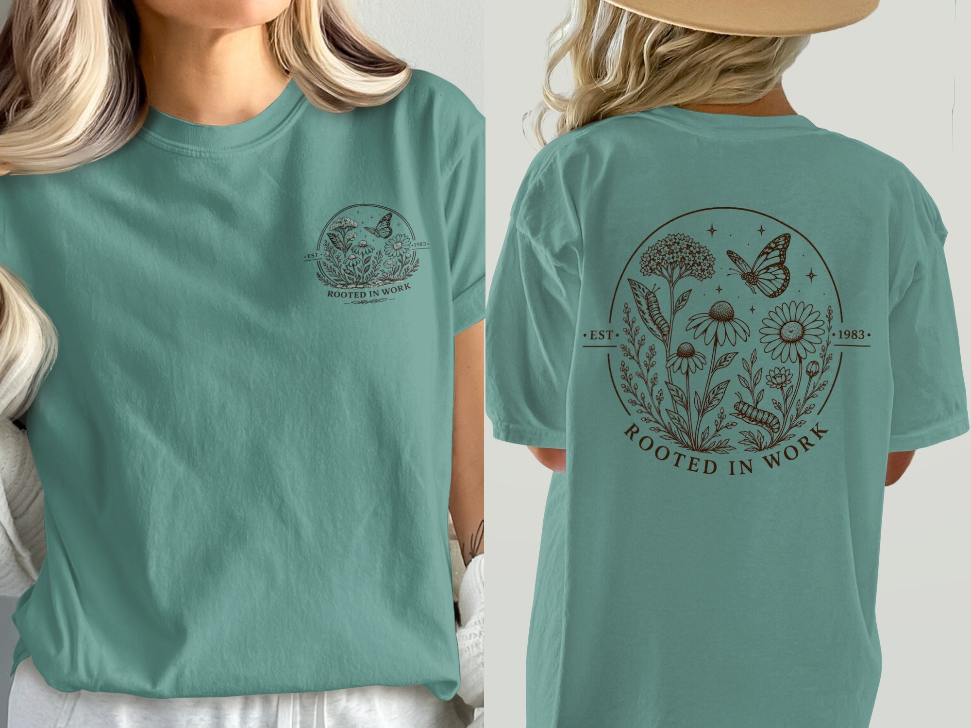 Teal t-shirt with circular floral design, butterfly, caterpillar, and text "ROOTED IN WORK".