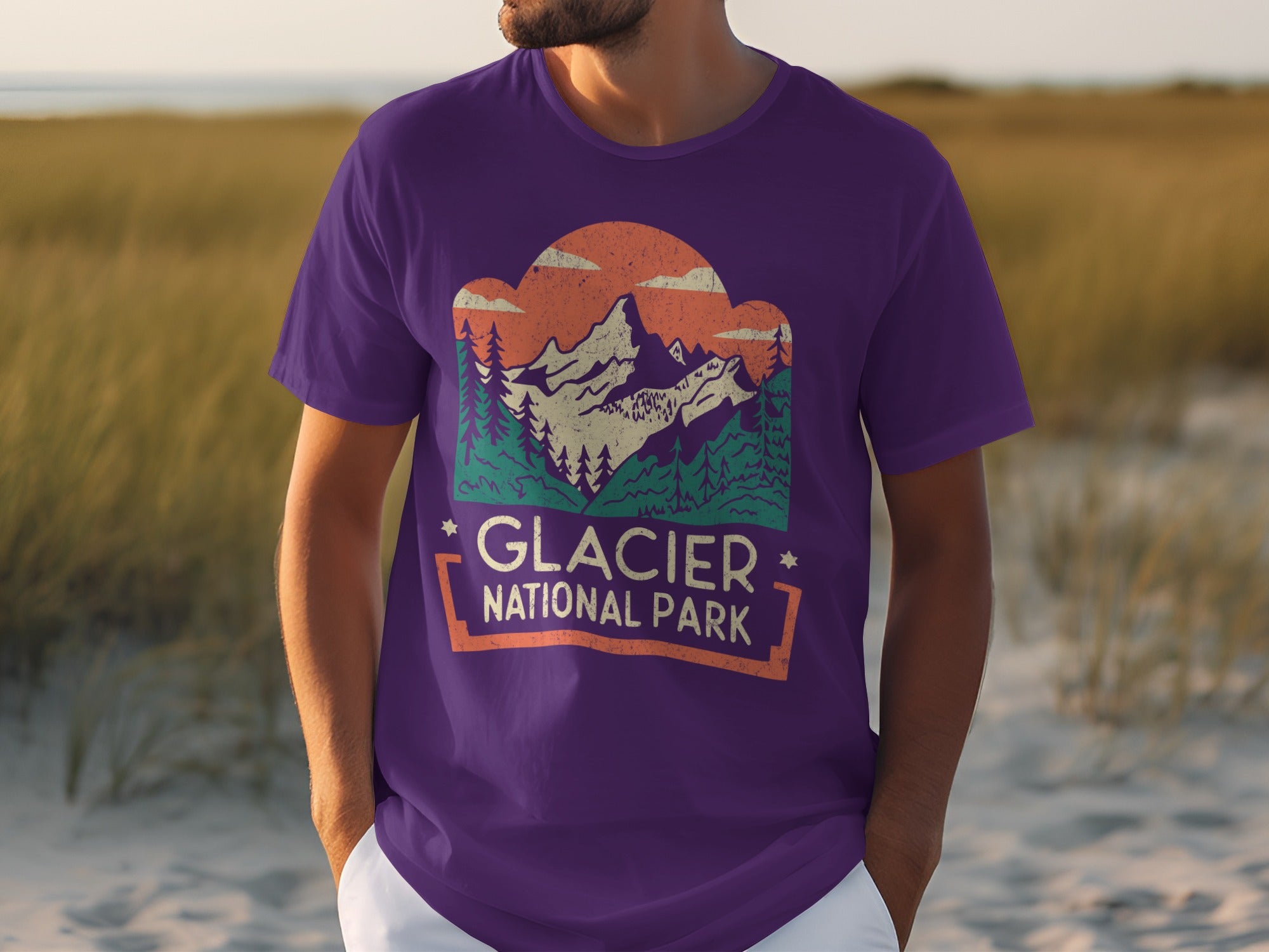 Purple t-shirt with vintage Glacier National Park mountain landscape graphic and text.