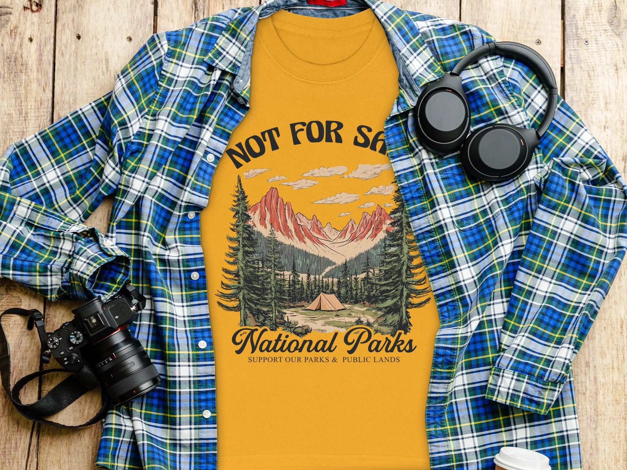Yellow t-shirt with national parks graphic and text "NOT FOR SALE NATIONAL PARKS".