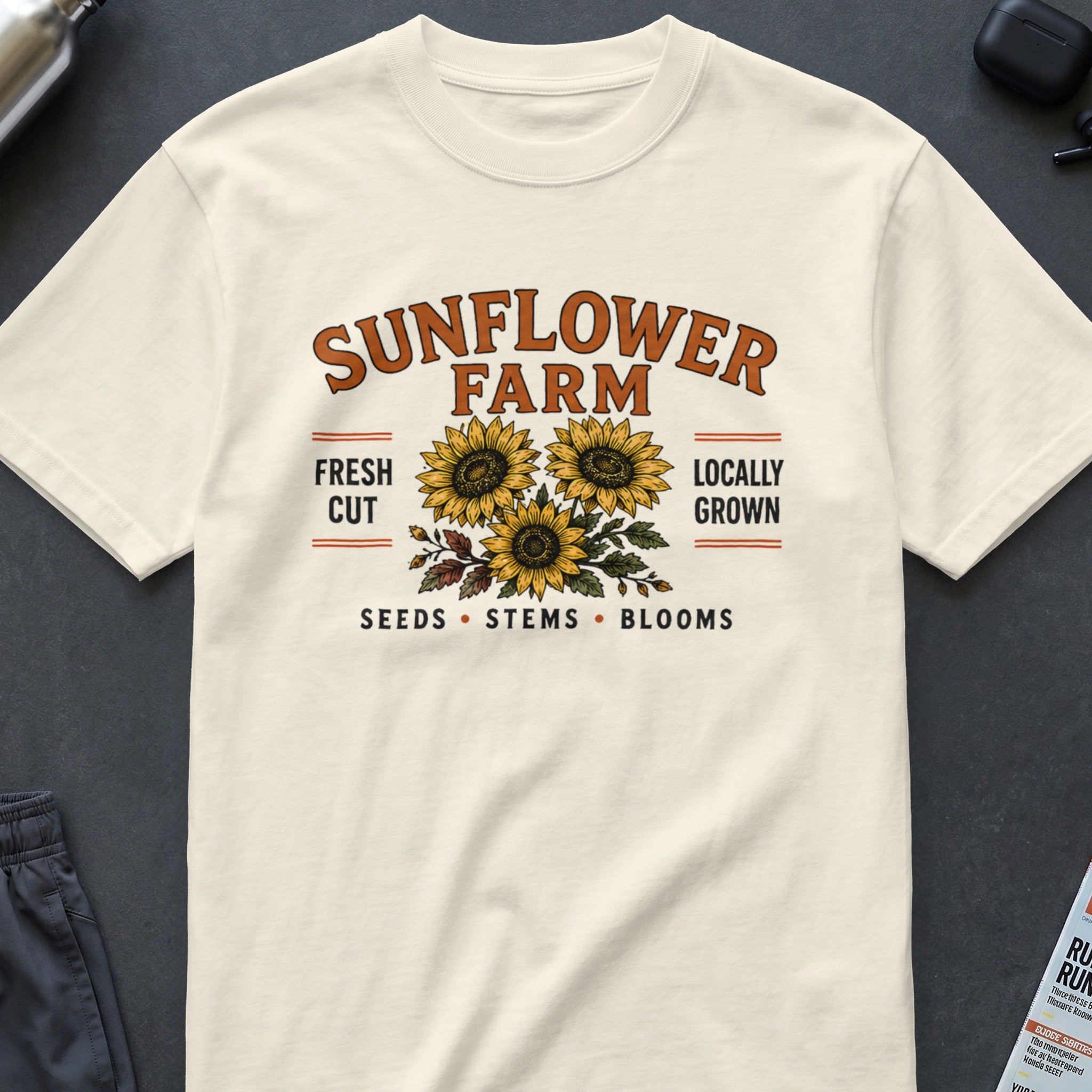 Cream t-shirt with "Sunflower Farm" text and three sunflowers graphic.