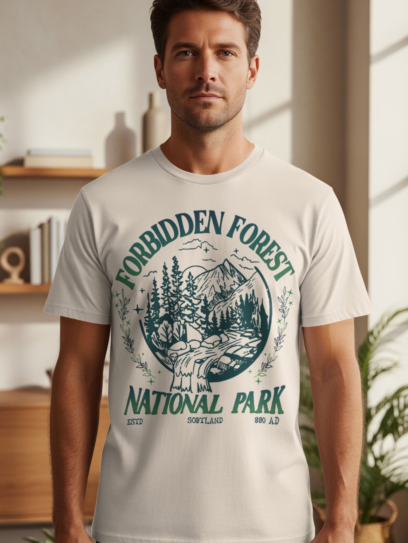 Light-colored t-shirt with Forbidden Forest National Park Scotland graphic.