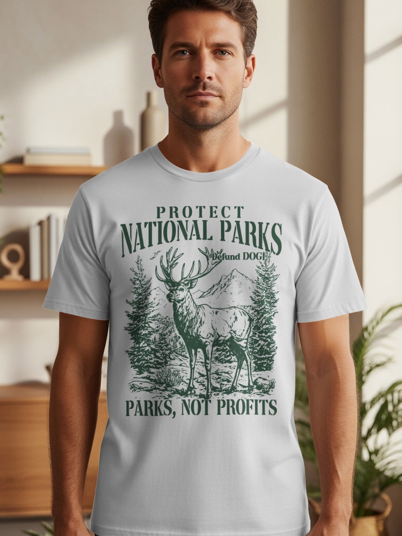 T-shirt with deer, trees, mountains, and text "Protect National Parks, Parks Not Profits".