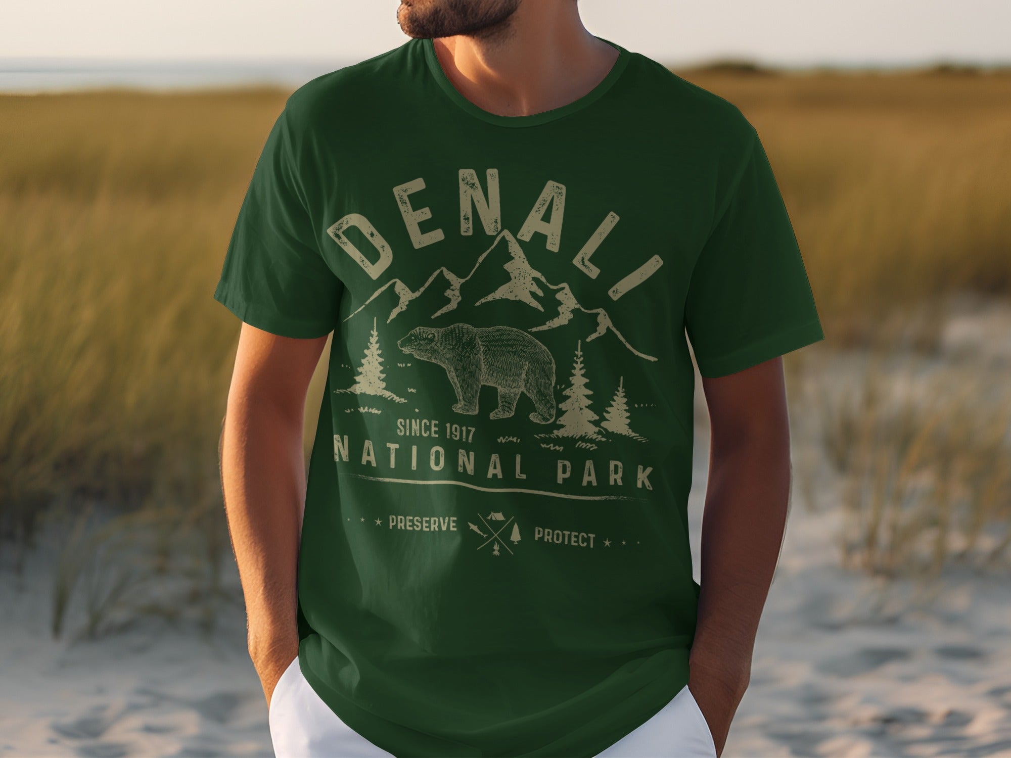 Green t-shirt with Denali National Park graphic featuring a bear and mountains.