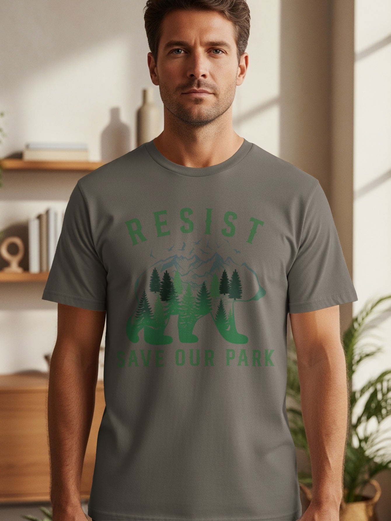 T-shirt with "RESIST SAVE OUR PARK" text and a bear silhouette filled with trees and mountains.